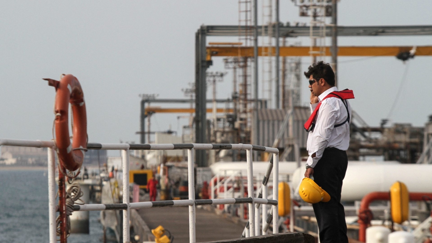 An Iranian technician stands at an oil facility in the Khark Island, on the shore of the Gulf, on 23 February 2016.