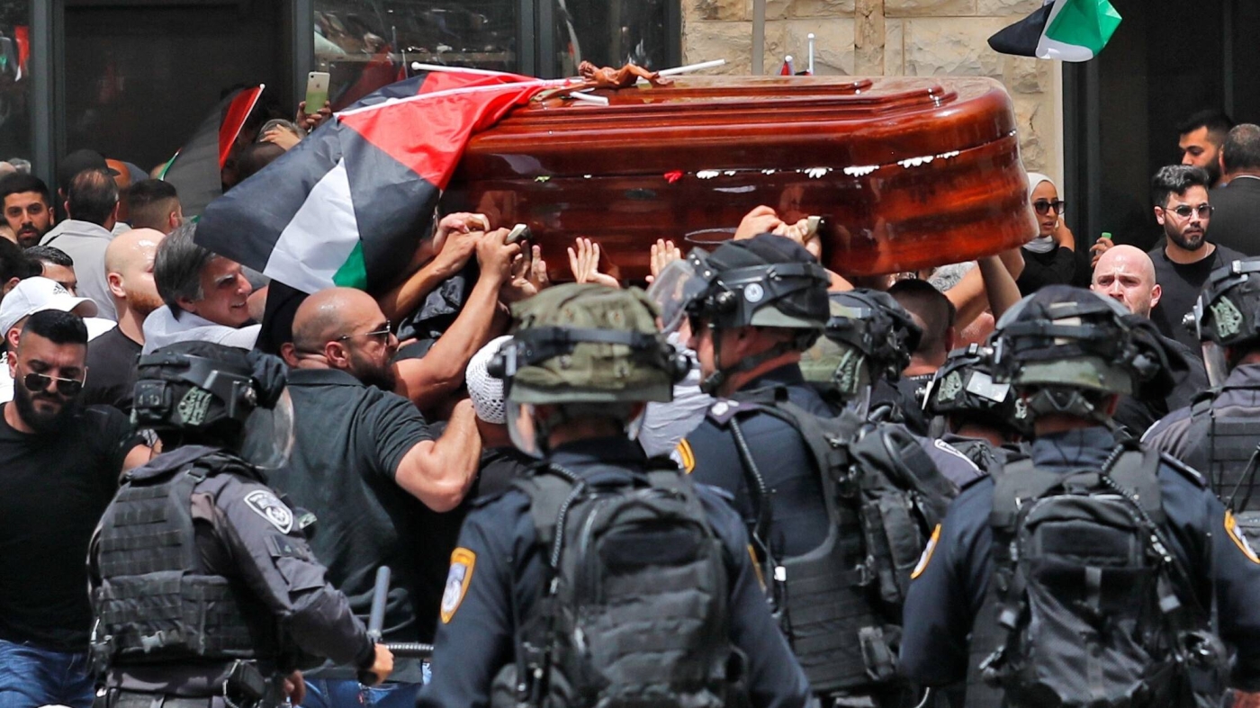 Israeli forces attack Palestinian mourners carrying the casket of slain Al Jazeera journalist Shireen Abu Akleh out of a hospital, before being transported to a church and then her resting place, in Jerusalem, on 13 May 2022