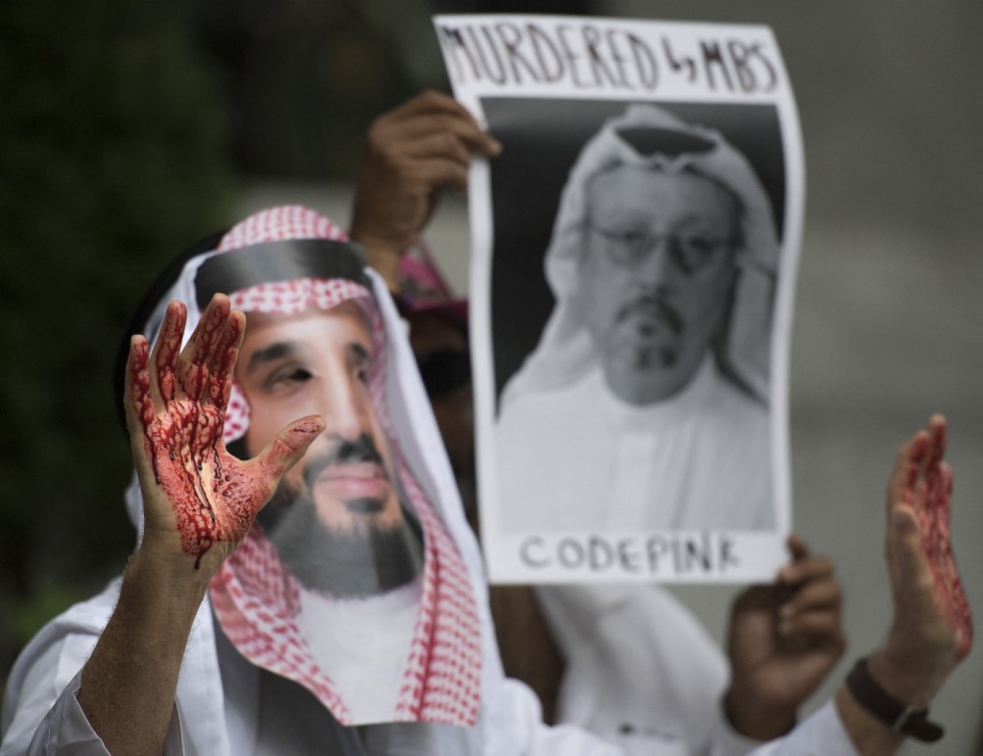 A demonstrator dressed as Crown Prince Mohammed bin Salman with blood on his hands protests outside the Saudi embassy in Washington, DC on 10 October 2018.