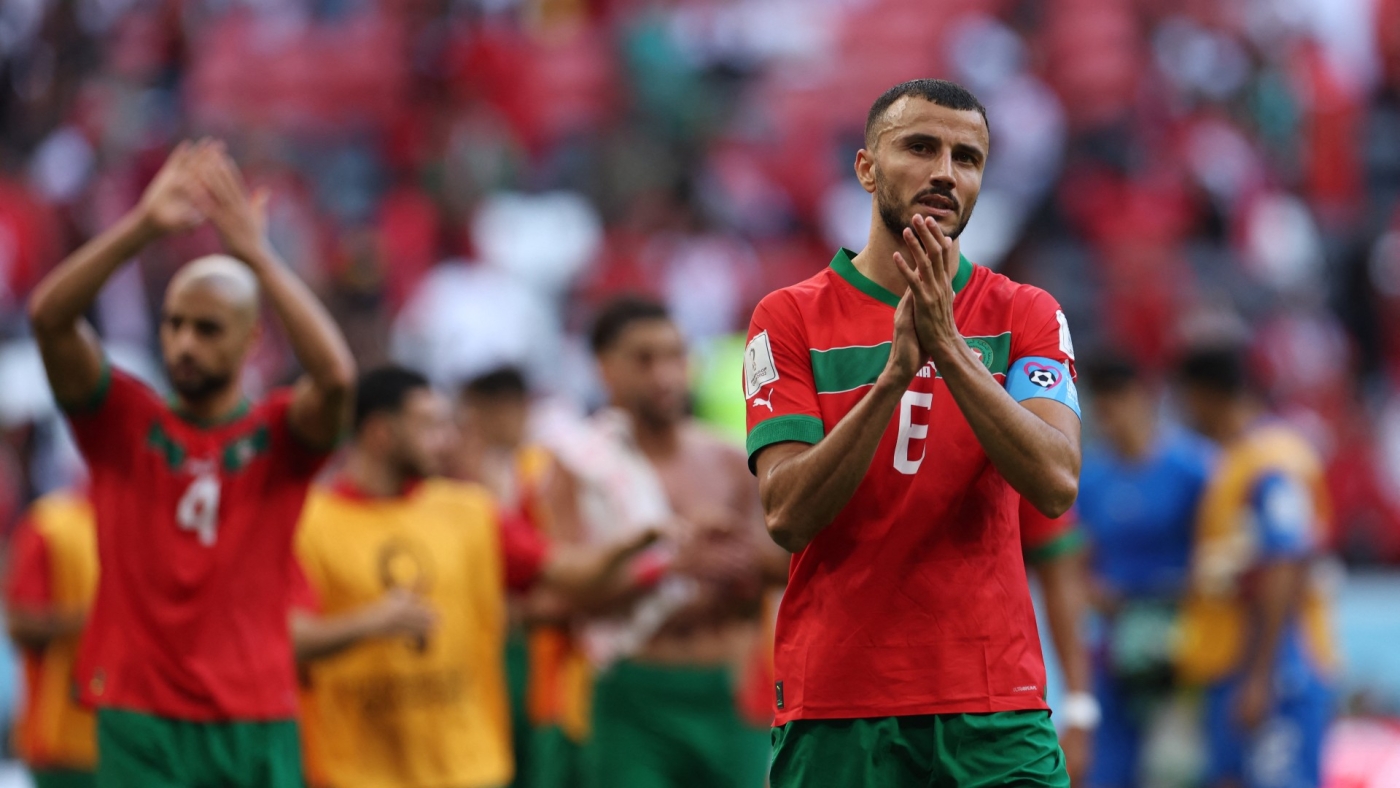Morocco's defender Romain Ghanem Saiss applauds after the 2022 World Cup match against Croatia at the Al-Bayt Stadium in Al Khor, north of Doha on 23 November 2022 (AFP)