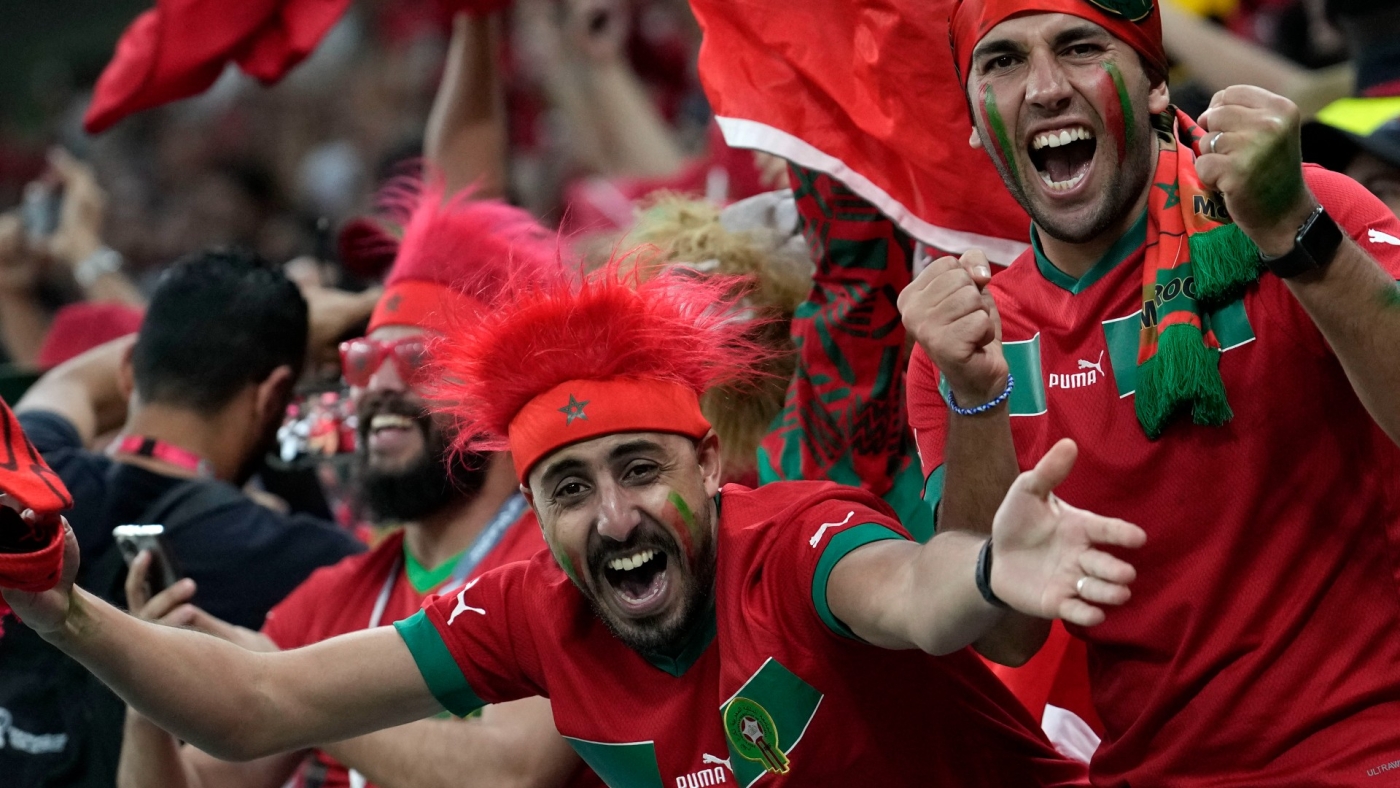 Morocco supporters celebrate during the World Cup group F match between Belgium and Morocco at Al-Thumama Stadium in Doha, Qatar on 27 November 2022 (AP)
