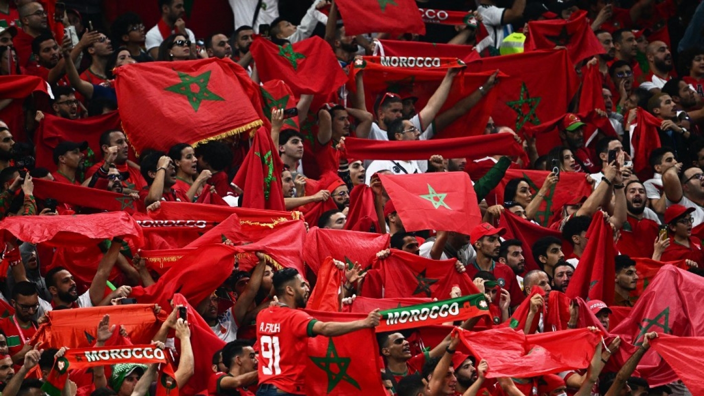 Supporters of Morocco cheer on the stands during the Qatar 2022 World Cup semi-final football match between France and Morocco at the Al-Bayt Stadium in Al Khor, north of Doha on 14 December 2022 (AFP)