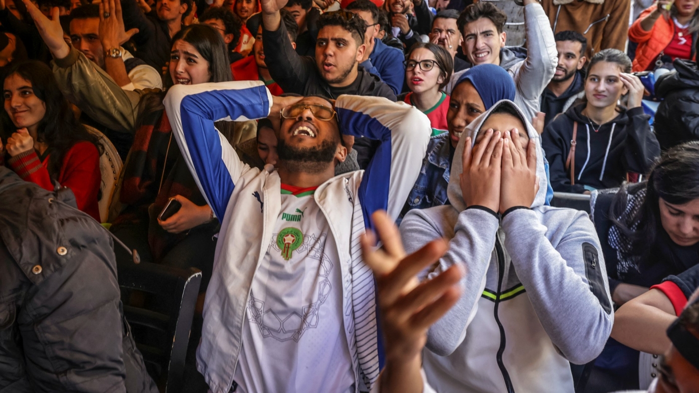 Morocco's supporters react as they watch the World Cup football match between Morocco and Portugal, at a coffee shop in Rabat on 10 December 2022 (AFP)