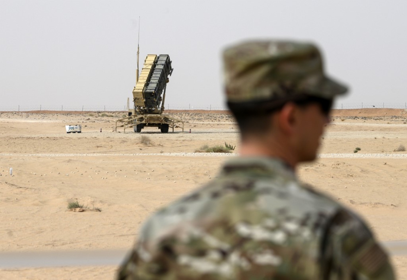 A US Air Force member looks on near a Patriot missile battery at the Prince Sultan air base in al-Kharj, Saudi Arabia on 20 February 2020.