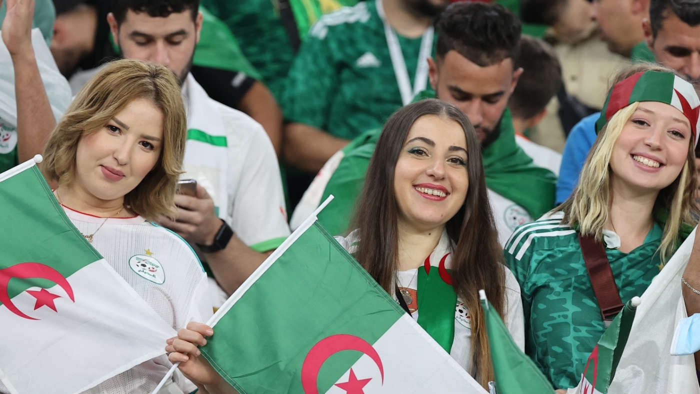 Algeria's supporters cheer ahead of the FIFA Arab Cup 2021 semi-final football match between Qatar and Algeria at the Al-Thumama stadium in the Qatari capital of Doha on on 15 December, 2021 (AFP)