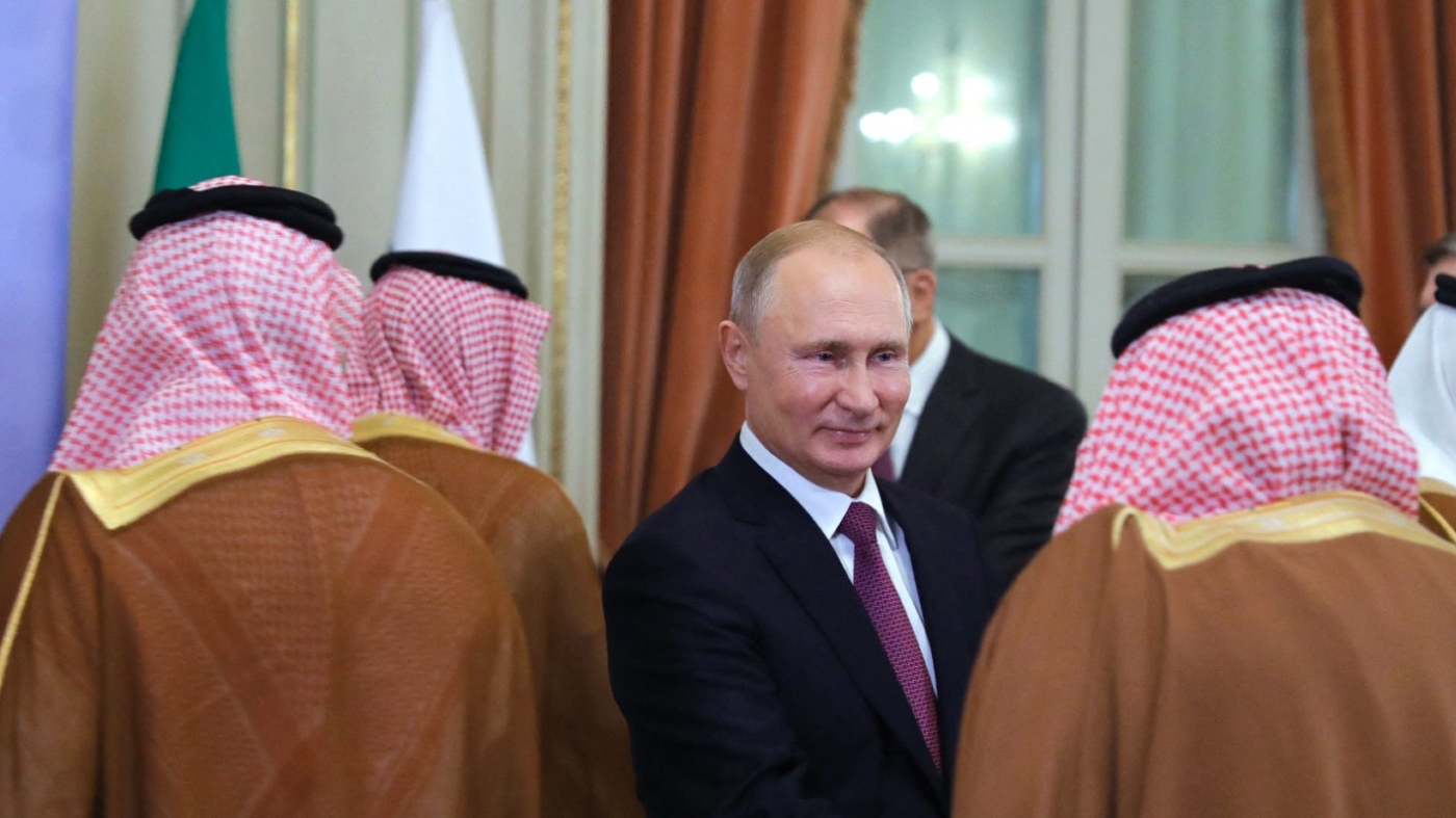 Russia's President Vladimir Putin (C) greets members of Saudi Crown Prince Mohammed bin Salman's delegation during a bilateral meeting at the G20 Leaders' Summit in Argentina on 1 December 2018.