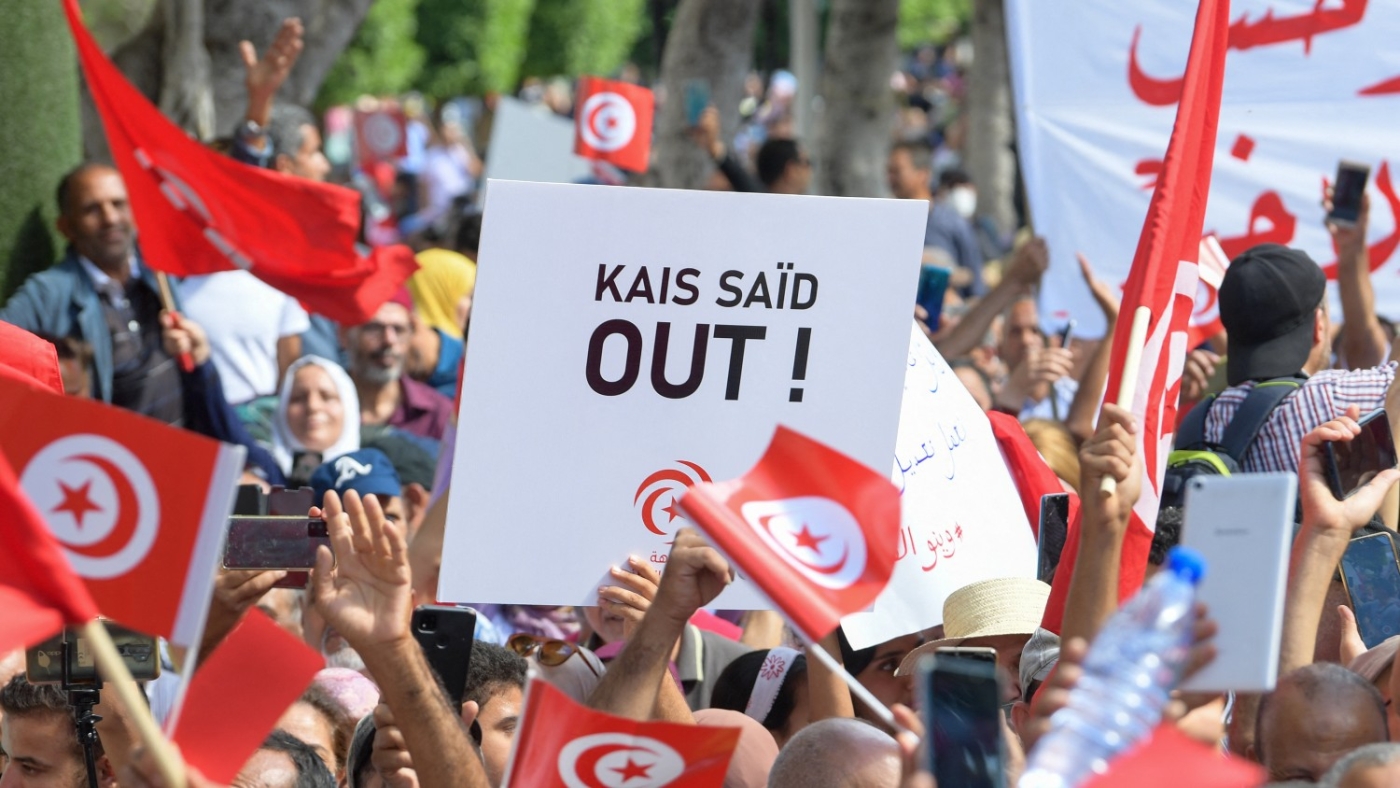 Supporters of Tunisia's Ennahda party wave the national flag during a demonstration against President Kais Saied in the capital Tunis on 15 October 2022.