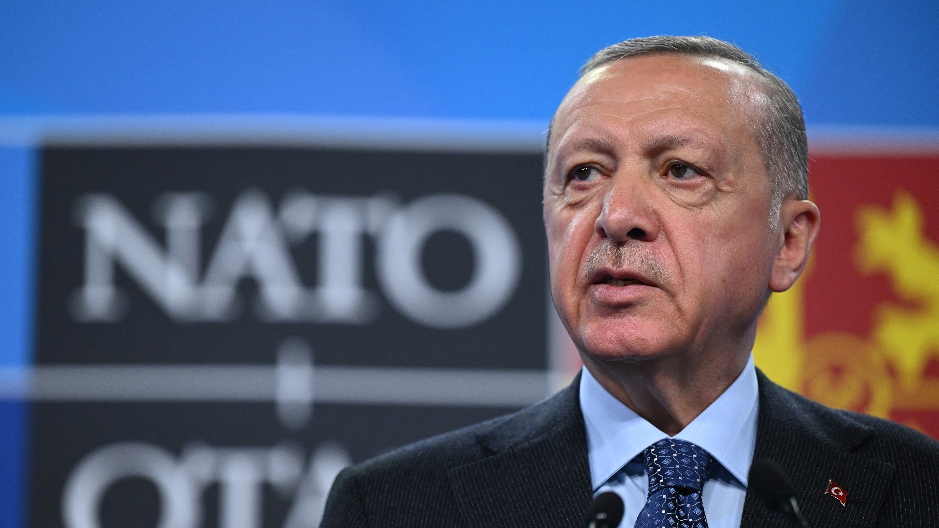 Turkey's President Recep Tayyip Erdogan addresses media during a news conference at a Nato summit on 30 June, 2022 (AFP)