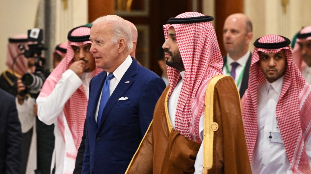 US President Joe Biden (L) and Saudi Crown Prince Mohammed bin Salman (R) arrive for the family photo during the Jeddah Security and Development Summit at a hotel in Jeddah on 16 July 2022.