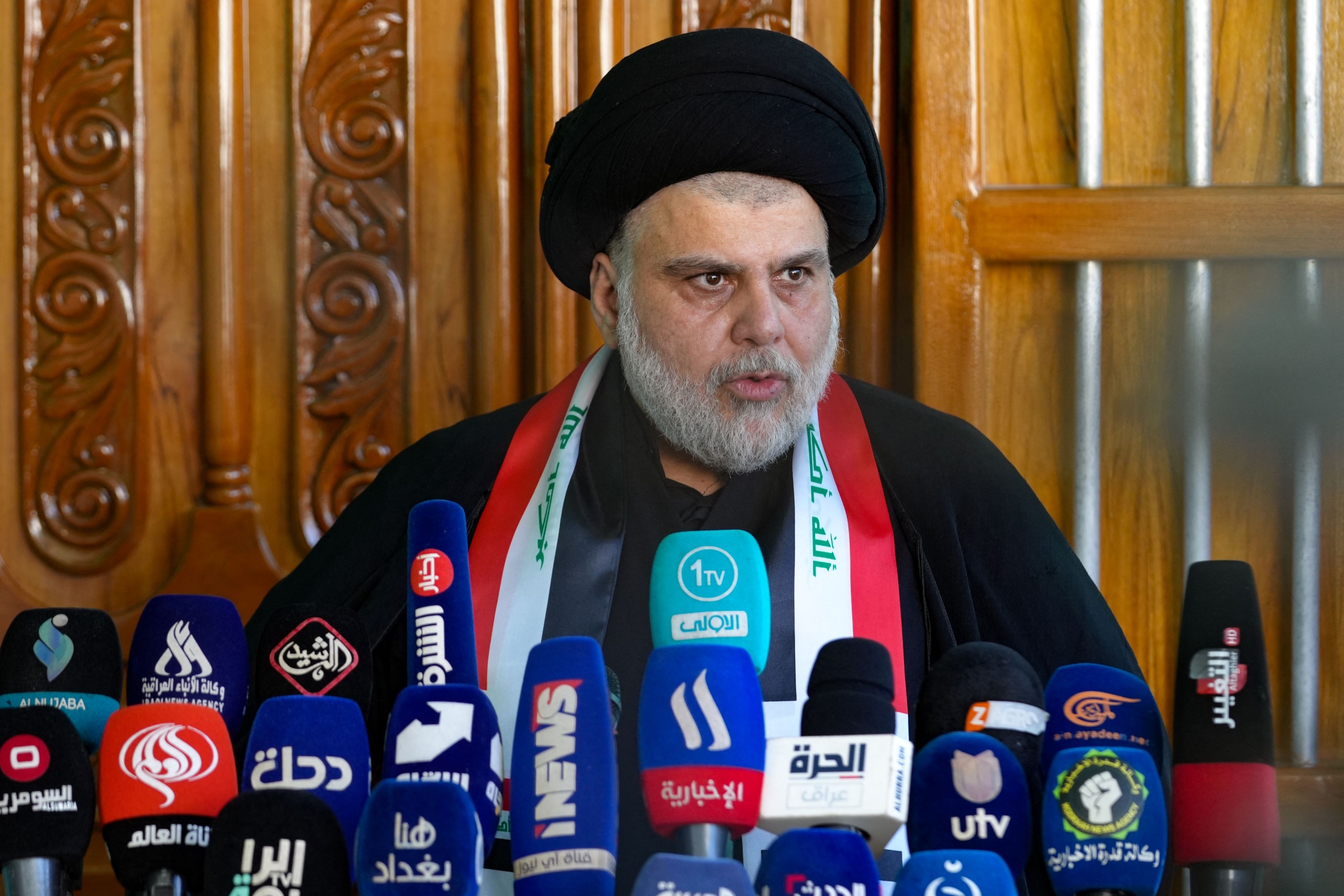 Iraqi cleric Moqtada Sadr gives a press conference at his home in the holy city of Najaf on July 20, 2023 (AFP)