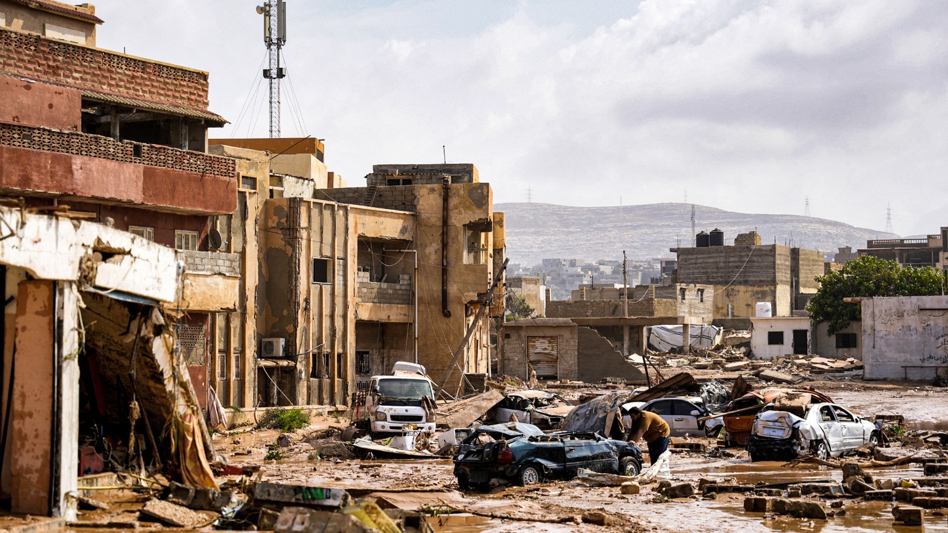 A view of destroyed vehicles and damaged buildings in Derna (AFP/The Press Office of Libyan Prime Minister - Benghazi)