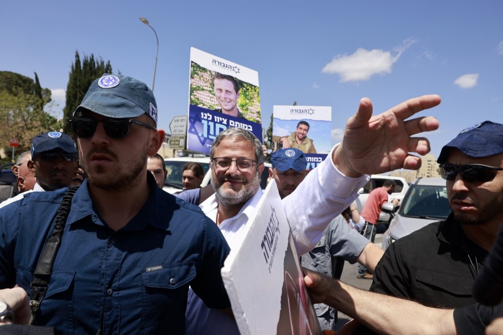 National Security Minister Itamar Ben Gvir greets supporters near the prime minister's office in Jerusalem on 5 May (Menahem Kahana/AFP)