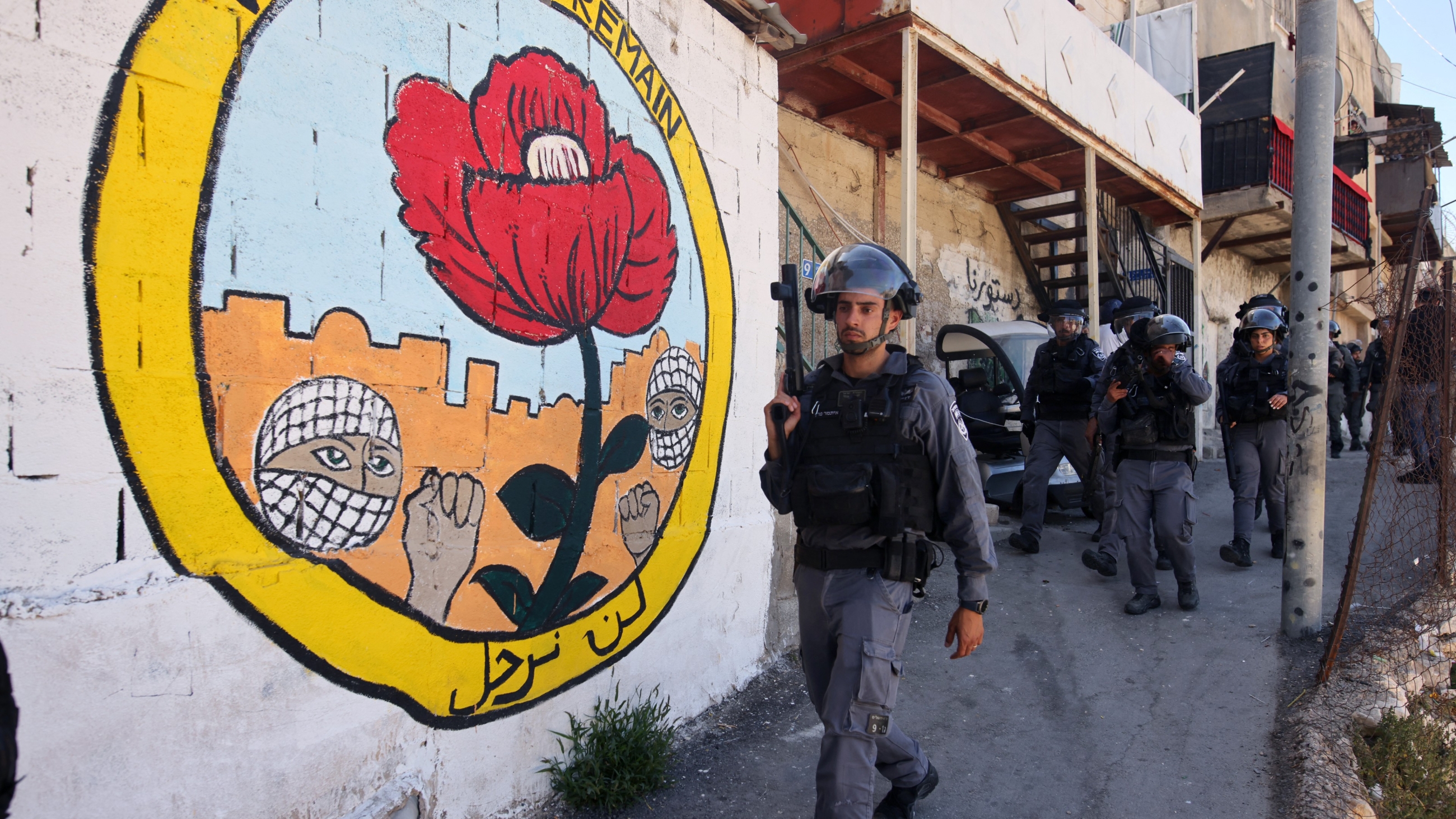 Israeli forces deploy during the demolition of Palestinian shops in Israeli-annexed east Jerusalem's neighbourhood of Silwan on 29 June 2021 (AFP)