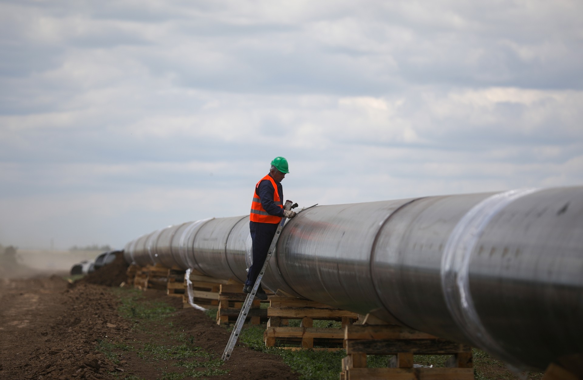 A worker is seen next to a pipe at a construction site on the extension of Russia's TurkStream gas pipeline in Bulgaria (Reuters)