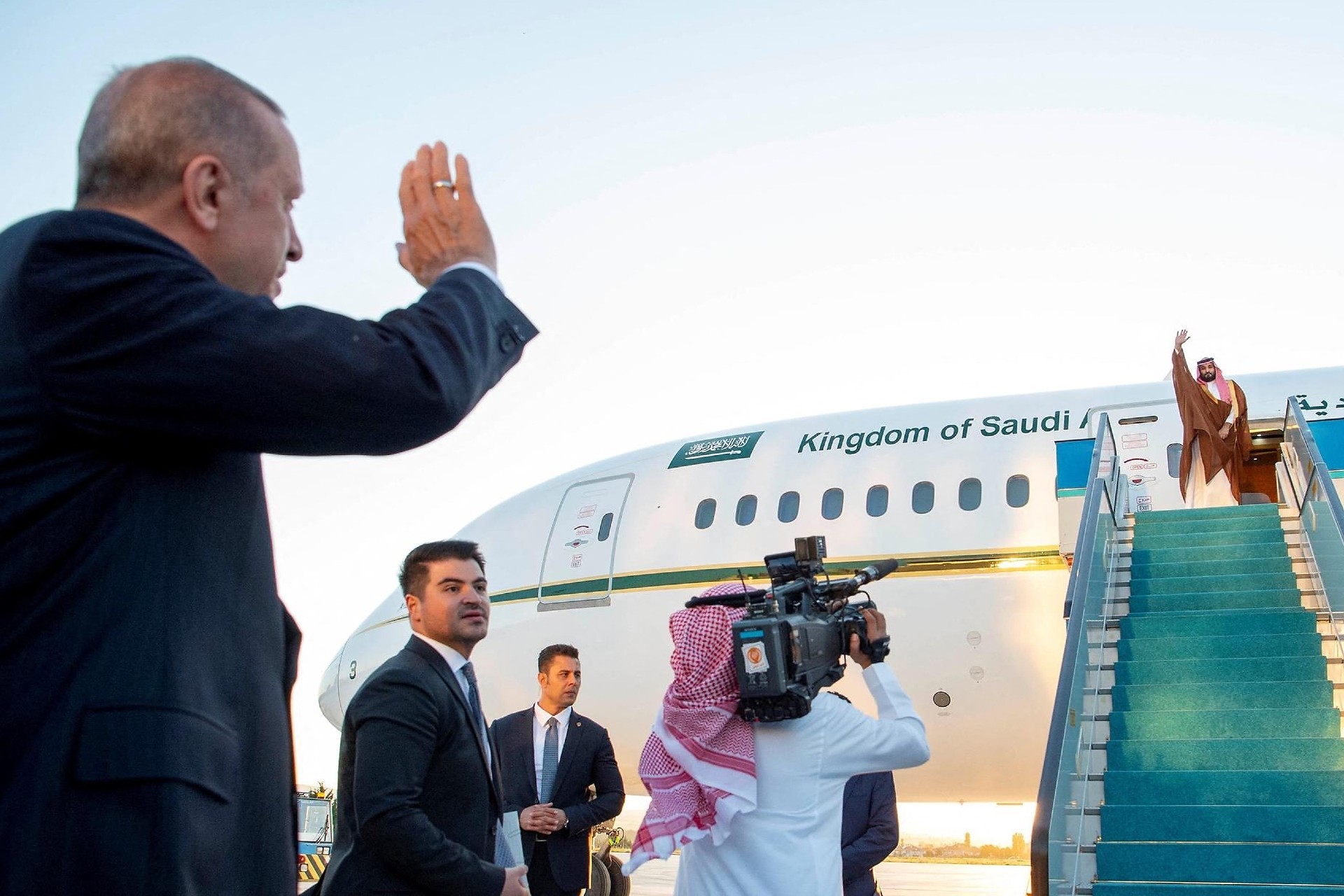 Turkish President Recep Tayyip Erdogan waves at Saudi Arabia’s Crown Prince Mohammed bin Salman at Ankara airport (Reuters)