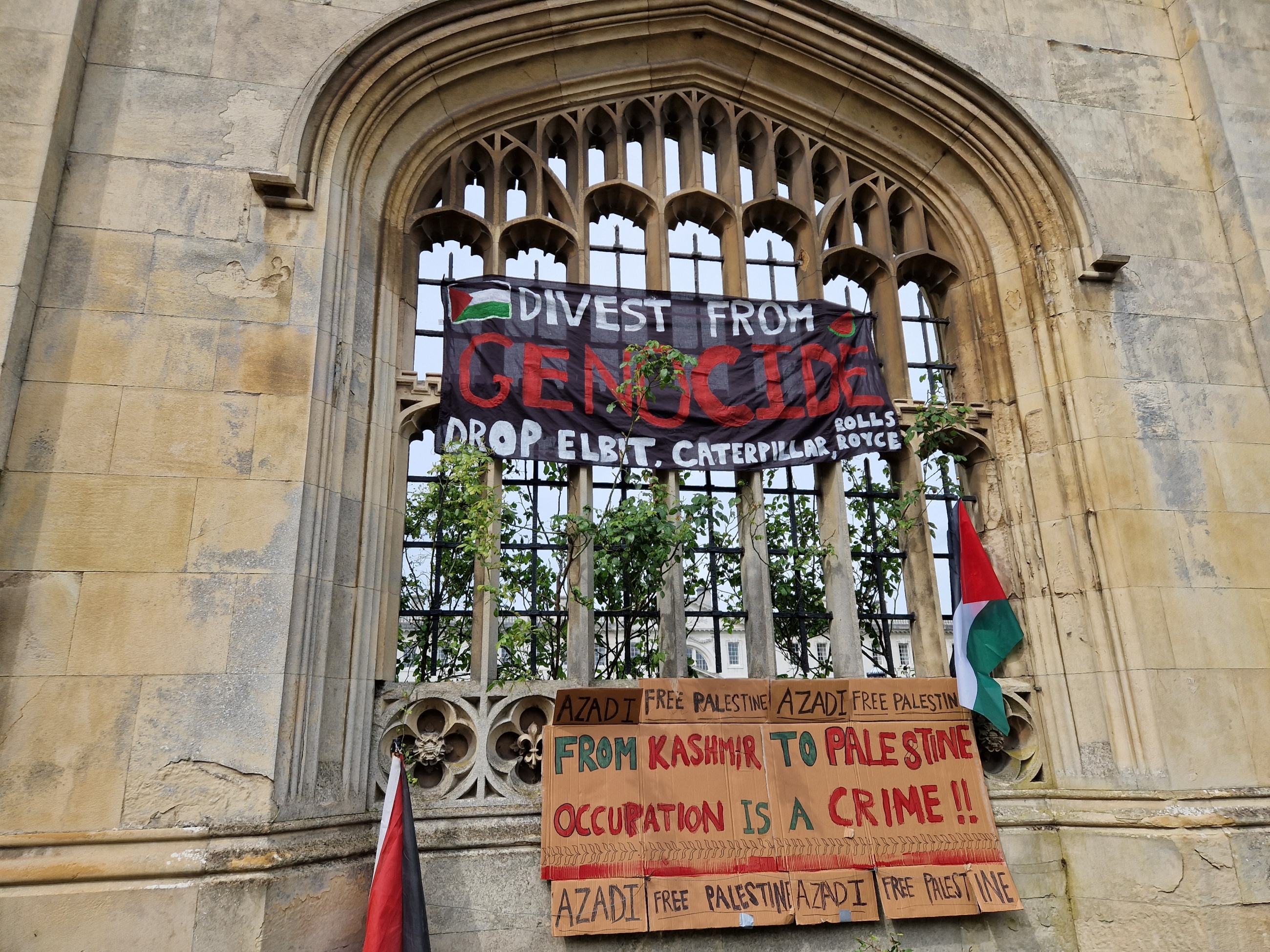 A banner calling for divestment at the student encampment for Gaza on Cambridge's iconic King's Parade