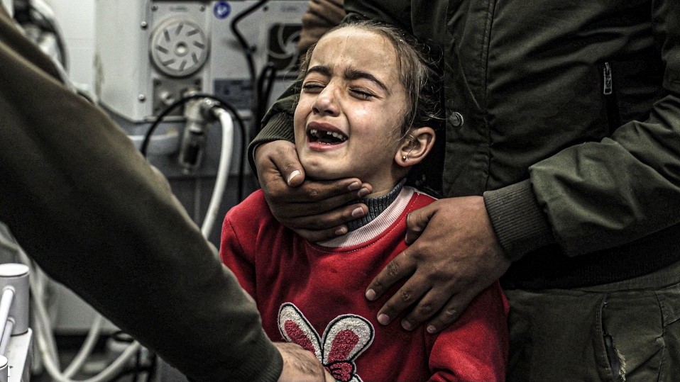 A girl mourns the death of her relatives who were killed by Israeli bombardment, at the European Hospital in Khan Yunis in the southern Gaza Strip on December 31, 2023