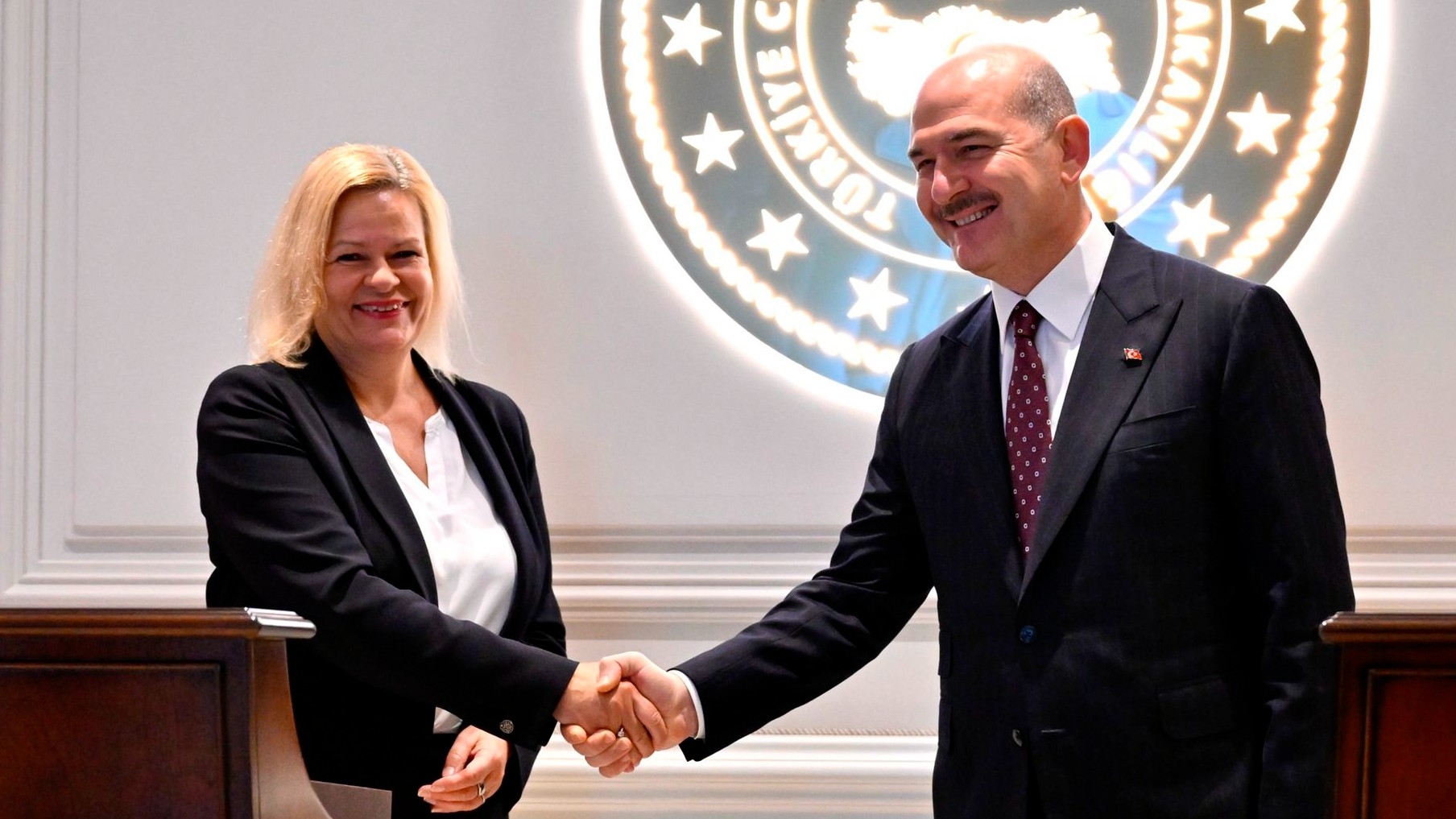 Interior Minister Suleyman Soylu, right, and German Interior Minister Nancy Faeser shake hands after a joint news conference in Ankara, on 22 November, 2022 (AP)