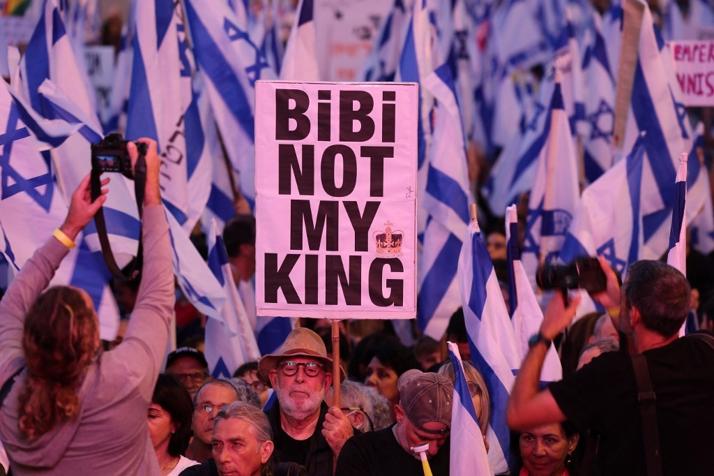 Demonstrators gather to protest against the Israeli government's judicial overhaul bill, in Tel Aviv on 6 May 2023 (AFP)
