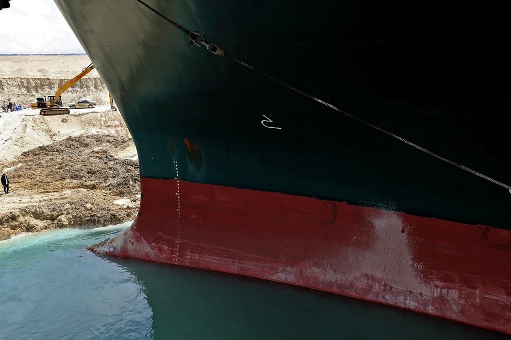 Rescue teams have been working for days to dislodge the Panama-flagged ship by removing sand and mud from around the port side of the vessel’s bow (AFP photo/HO/Suez Canal)