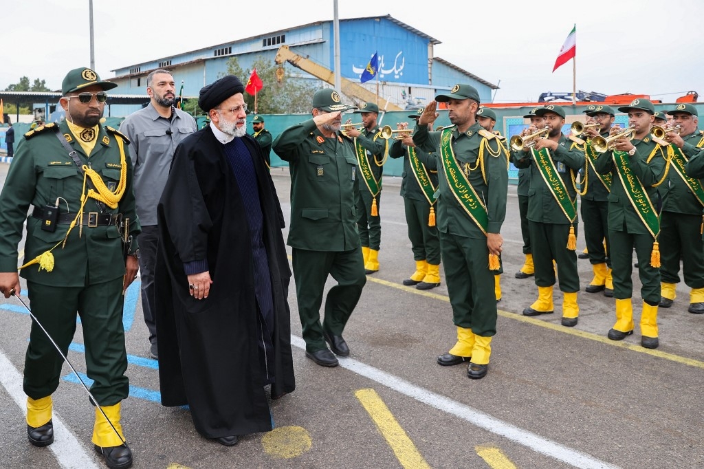 A handout picture made available by the Iranian presidential office on 2 February 2024 shows Iranian President Ebrahim Raisi visiting the Iranian revolutionary guards corps (IRGC) navy base in Bandar Abbas, southern Iran (Iranian Presidency/AFP) 