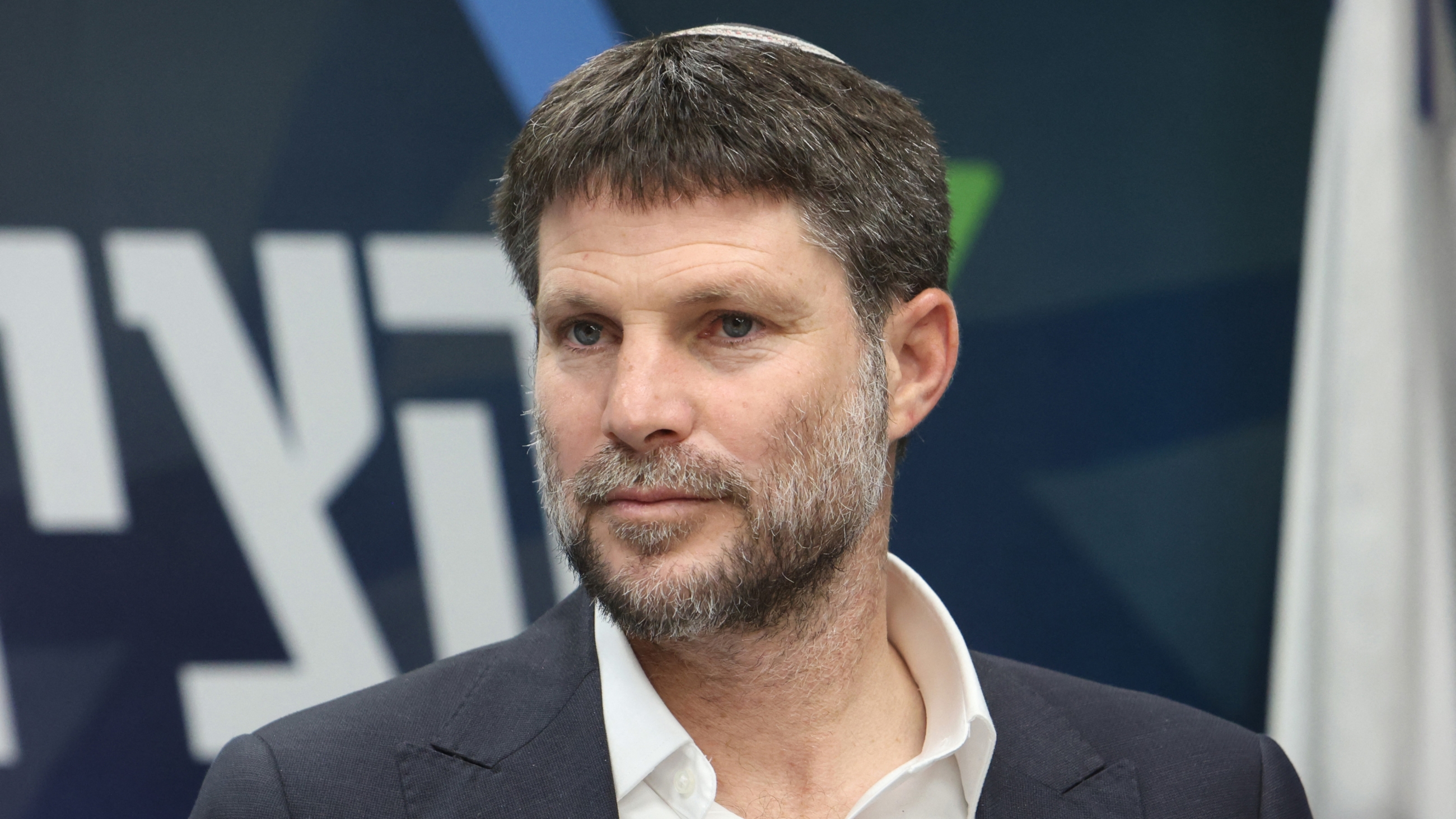 Israel's Finance Minister and leader of the Religious Zionist Party Bezalel Smotrich attends a meeting at the parliament, 20 March 2023 (AFP)