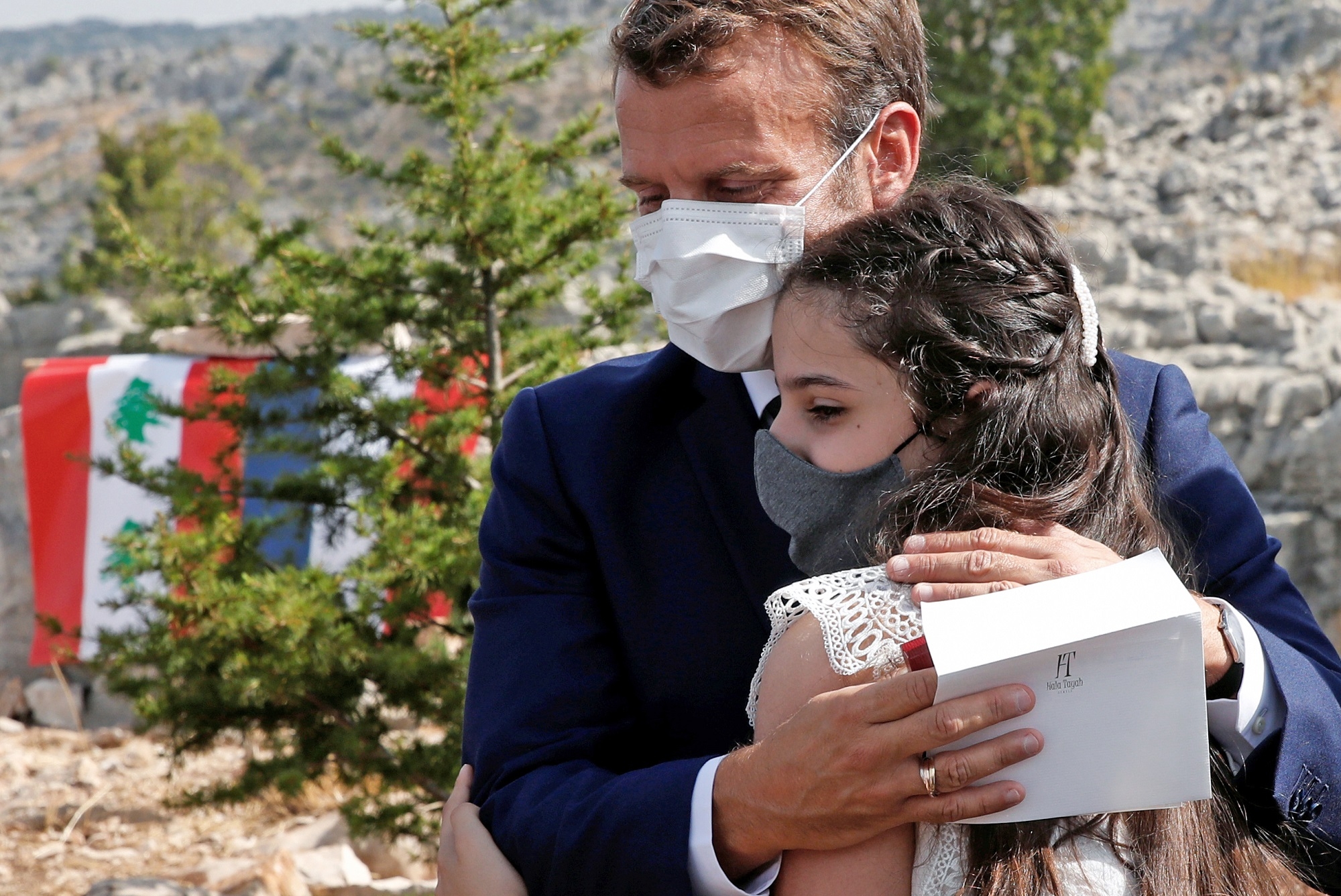 Macron hugs a blast victim during visit to Beirut