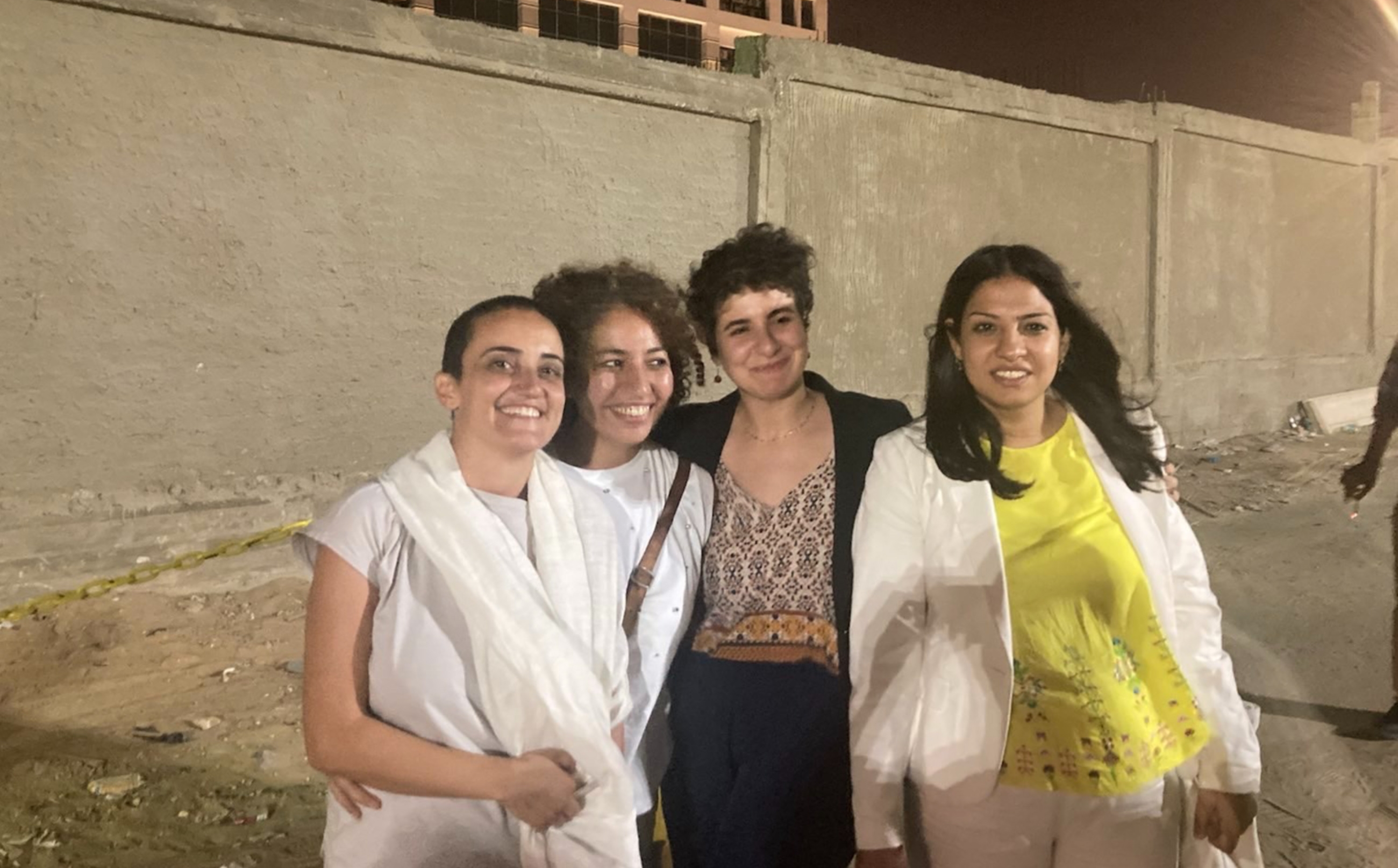 (R-L) Mada Masr Editor-in-Chief Lina Attalah, journalists Beesan Kassab, Sara Seif Eddin and Rana Mamdouh pose in front the Cairo Appeals Prosecution after being released on bail (Mada Masr)
