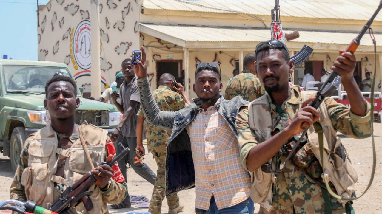 Sudanese army soldiers loyal to Abdel Fattah al-Burhan pose for a picture at the Rapid Support Forces base in Port Sudan, on 16 April 2023.