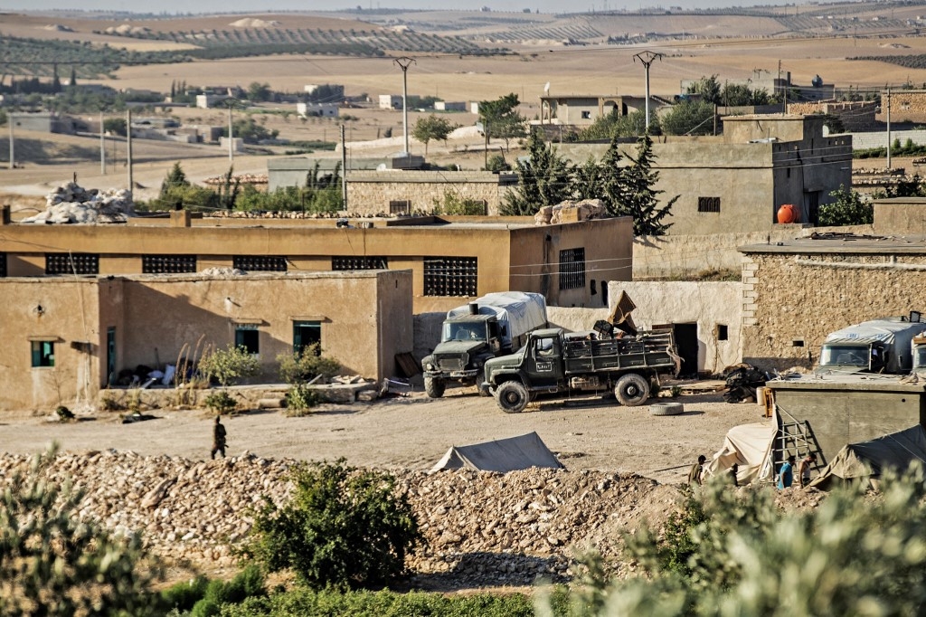 Syrian government forces are seen in Syria's northern city of Manbij, located near the border with Turkey, on 21 July 2022 (AFP)