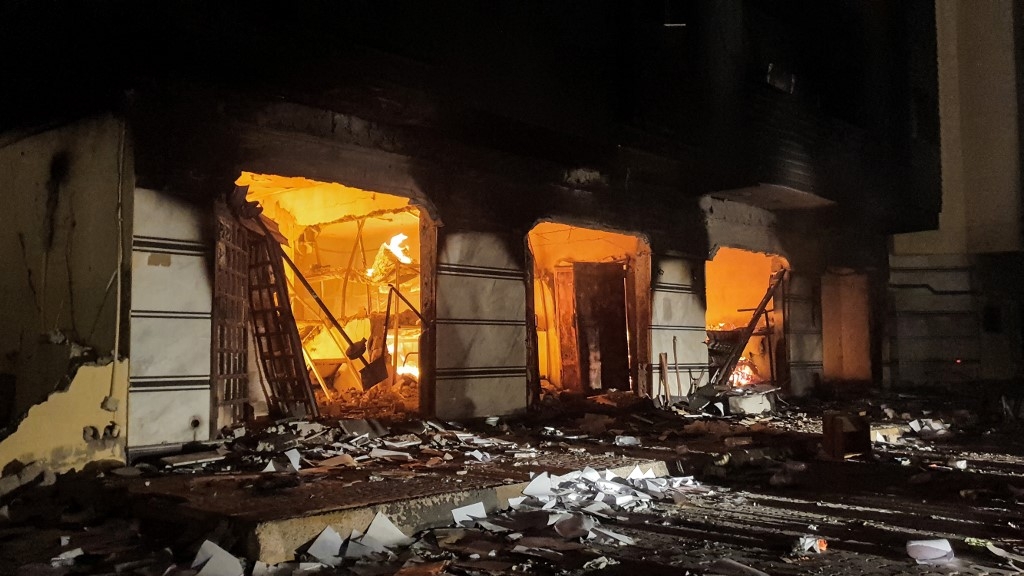 A fire inside Libya's Tobruk-based parliament building, lit by protesters who broke inside, 2 July 2022 (AFP)