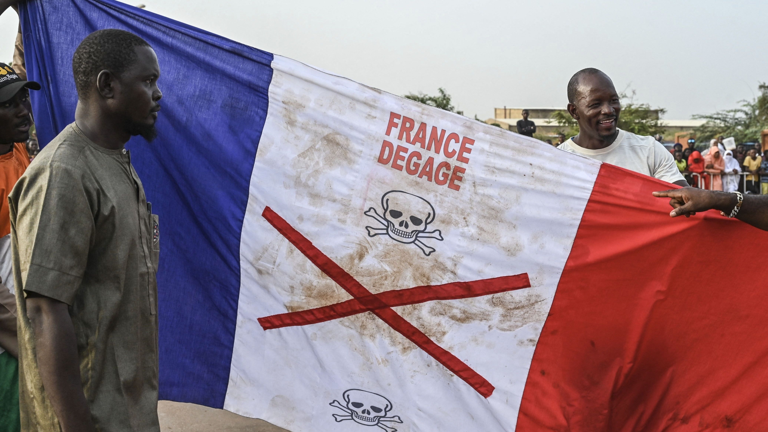 Nigeriens demand the end to the French military presence in their country during a protest on 1 September