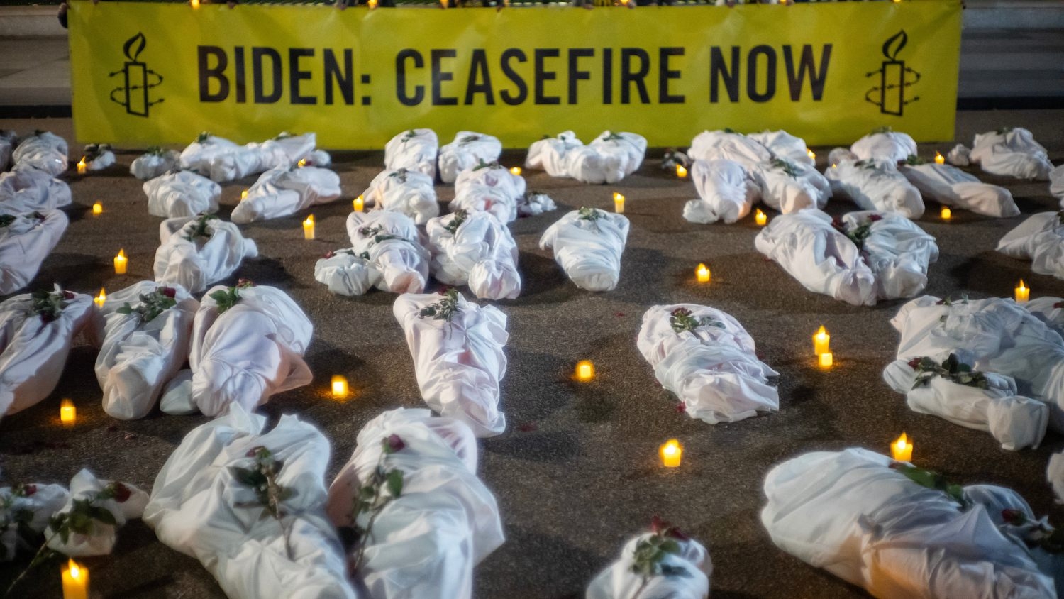 White-shrouded body bags, representing victims in the war in Gaza, are seen during a vigil in front of the White House in Washington on 15 November 2023.