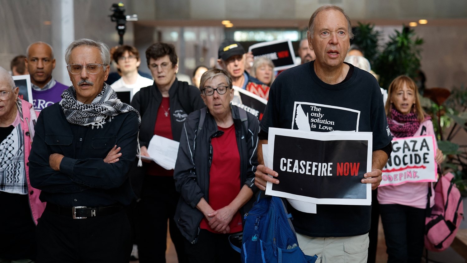 Demonstrators sing as they walk out of the Hart Senate Office Building following a prayer gathering for a ceasefire in the war in Gaza on Capitol Hill on 9 November 2023 in Washington.