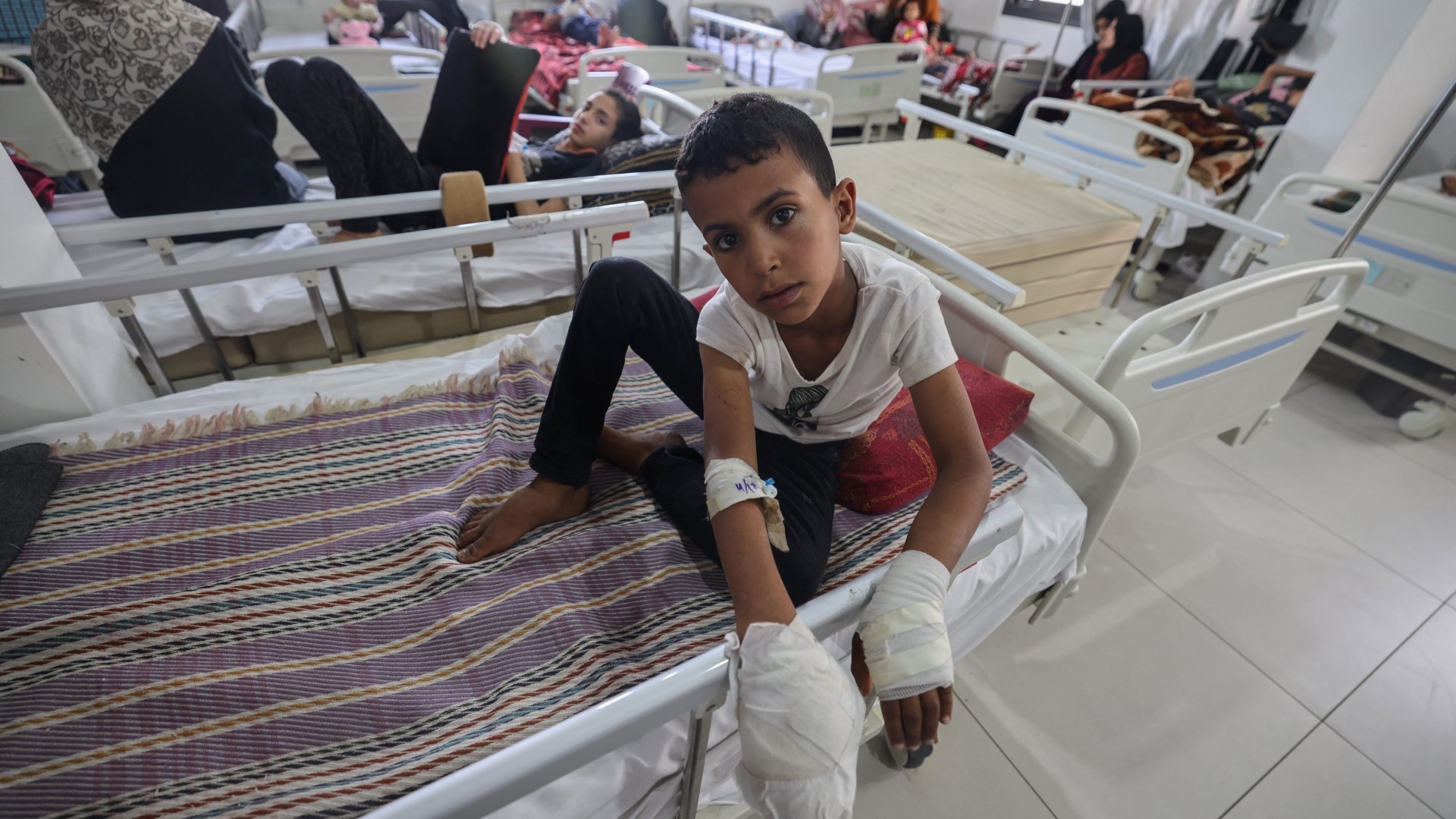 A wounded Palestinian boy receives treatment at the Rafah Indonesian Field Hospital in the southern Gaza Strip on 24 April (AFP/Mohammed Abed)