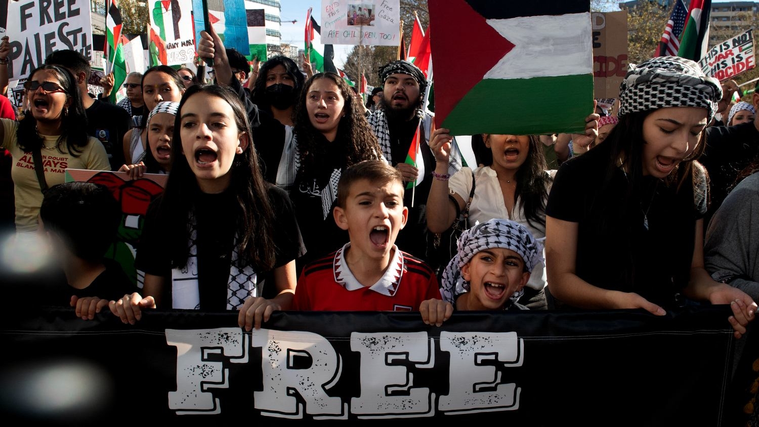 Demonstrators chant slogans as they march in support of Palestinians in Denver, Colorado, on 5 November 2023.