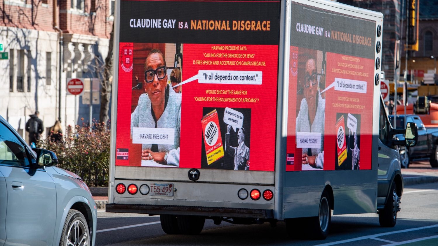 A truck calling the president of Harvard a disgrace drives around Harvard University in Cambridge, Massachusetts on 12 December 2023.
