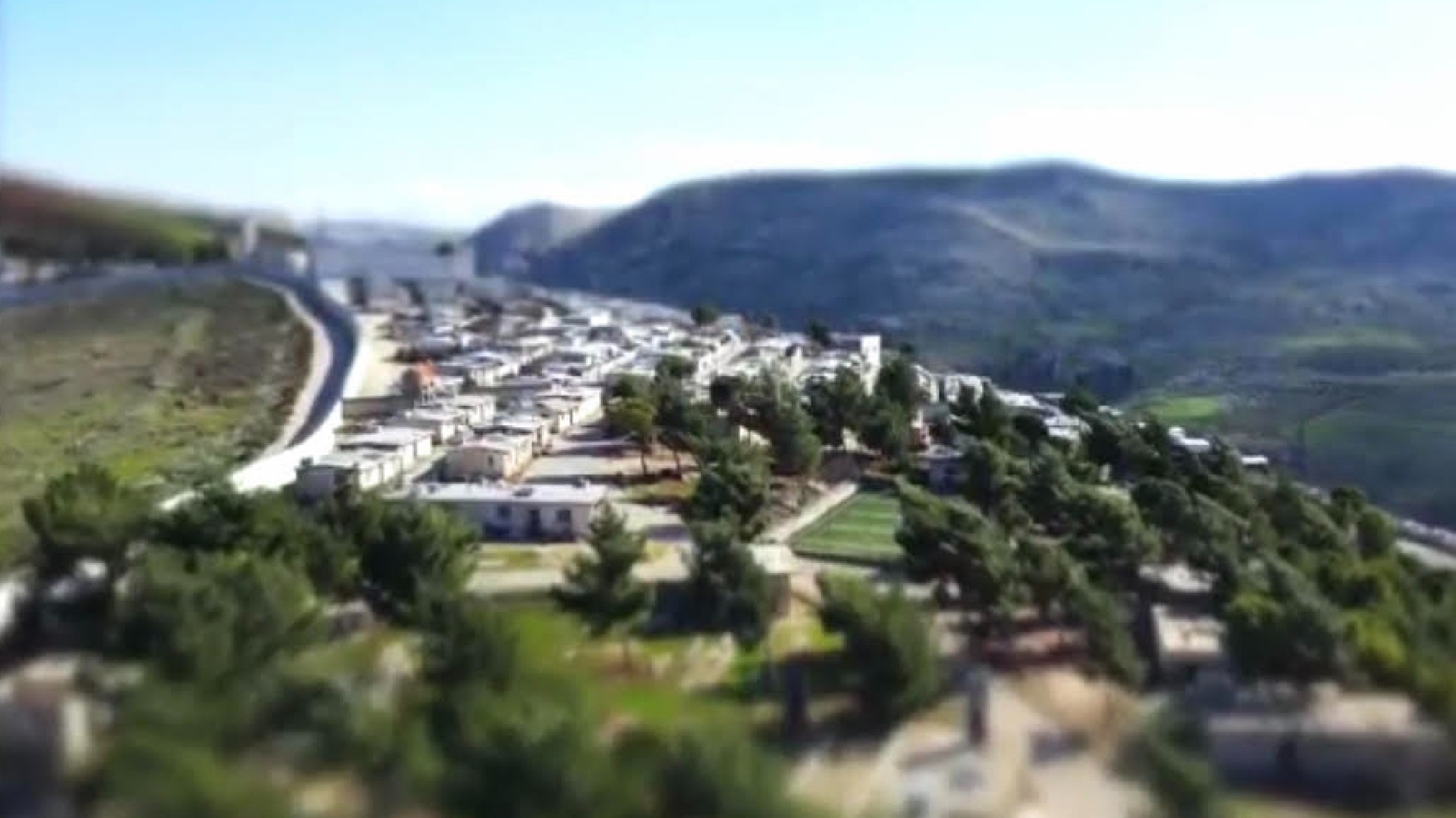 A screengrab from a propaganda video released by Omsen's Firqat al Ghouraba showing the camp where they reside in the Syrian town of Harem