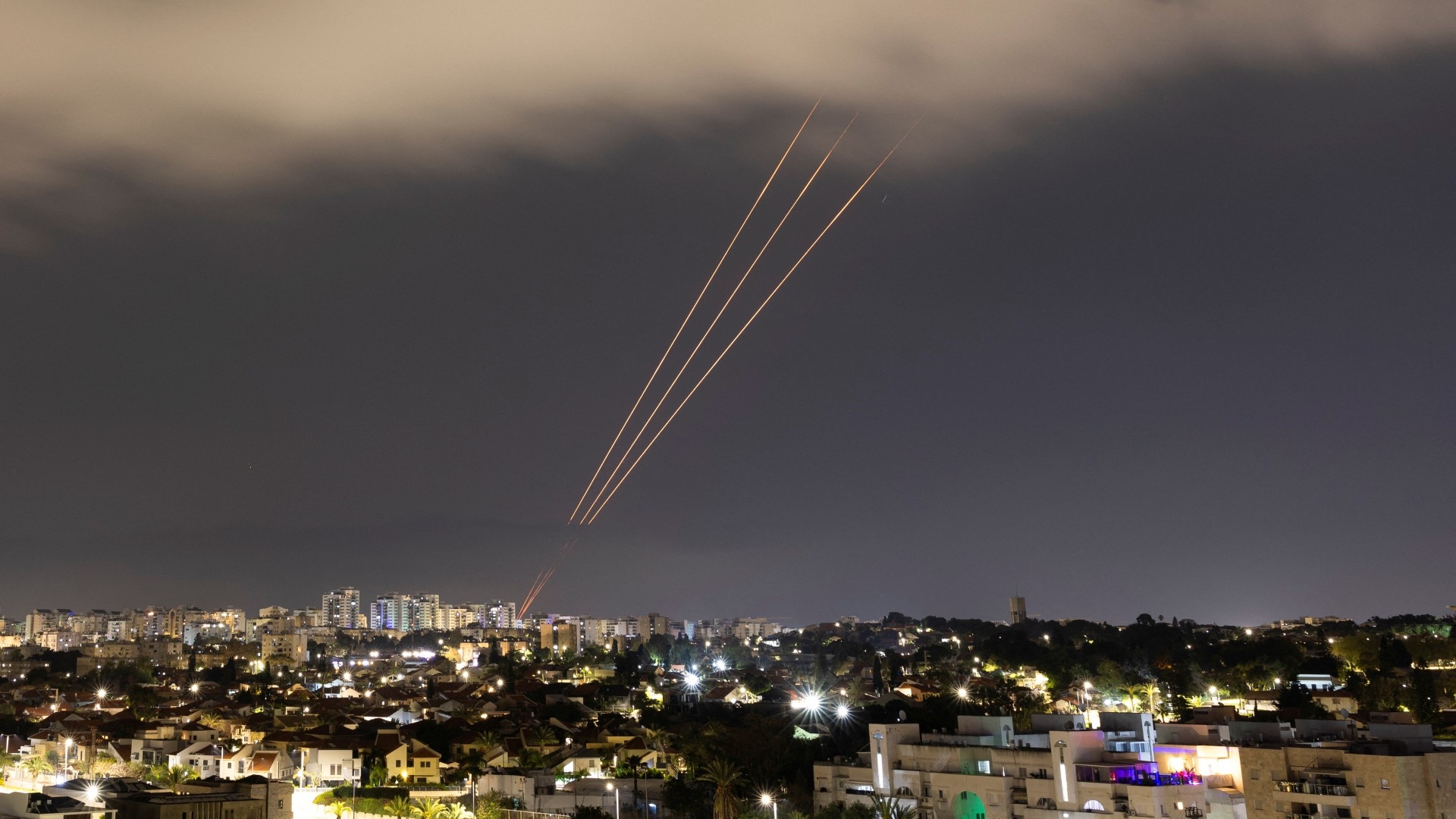 An anti-missile system operates after Iran launched drones and missiles towards Israel, as seen from Ashkelon, 14 April (Reuters/Amir Cohen)