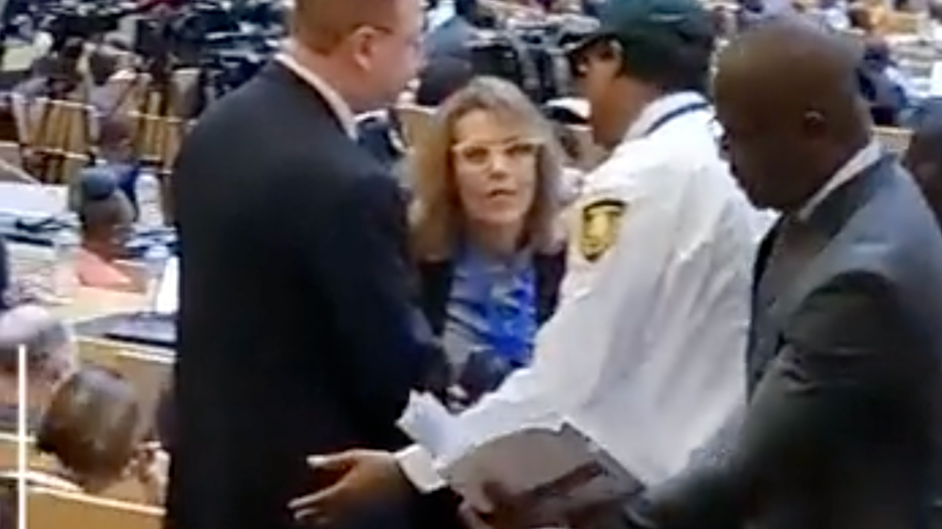 Sharon Bar-Li, the deputy director of the African Division at the Israeli foreign ministry, escorted out of the African Union summit in Ethiopia's Addis Ababa on 18 February 2023 (Screengrab)