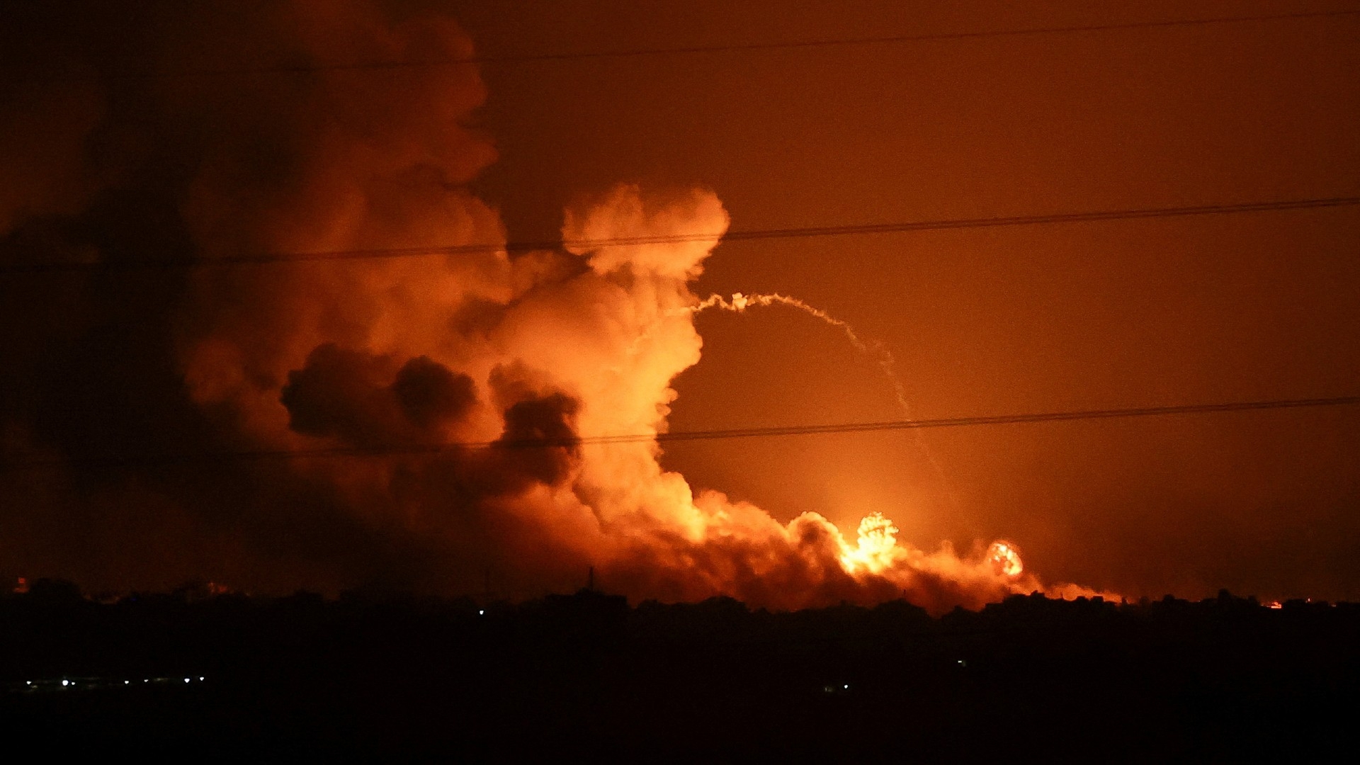 Smoke and flames rise during Israeli strikes in the Gaza Strip, as seen from southern Israel on 5 November 2023 (Reuters)