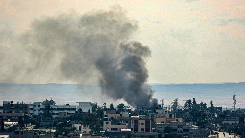 Smoke billows over Rafah, Gaza, after Israeli bombing on 13 February 2024 (Said Khatib/AFP)