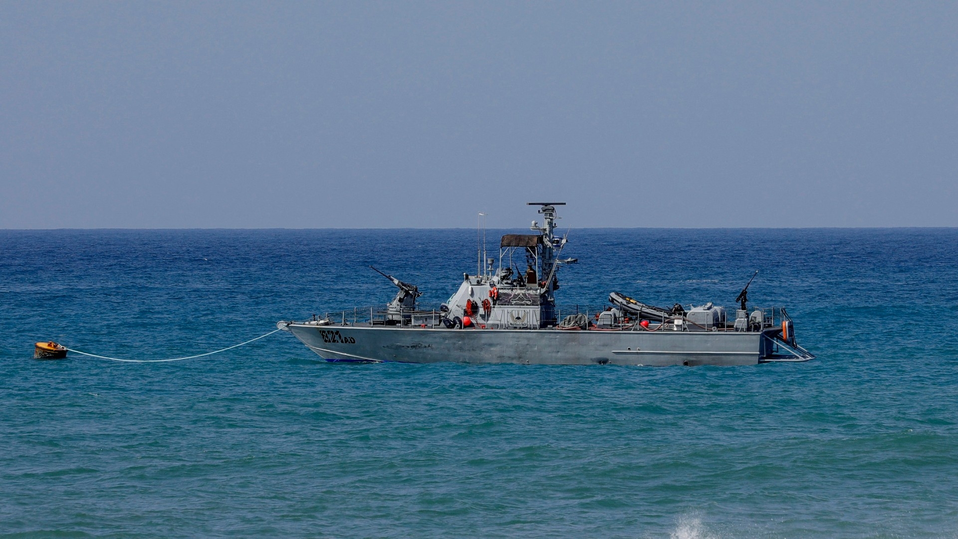 An Israeli Navy vessel is moored in Mediterranean waters off Israel's crossing at Rosh Hanikra, known in Lebanon as Ras al-Naqura, at the border between the two countries on 4 October 2022 (AFP)