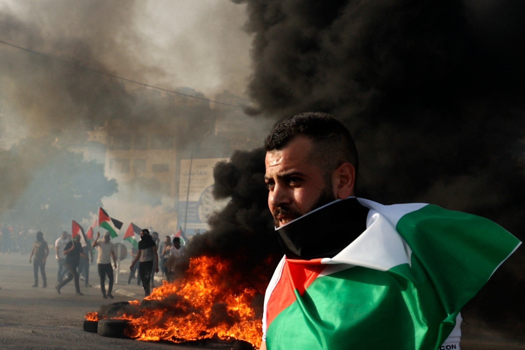 A Palestinian protester at a demonstration outside the Huwara military checkpoint near Nablus in the occupied West Bank on 29 May 2022. (AFP)
