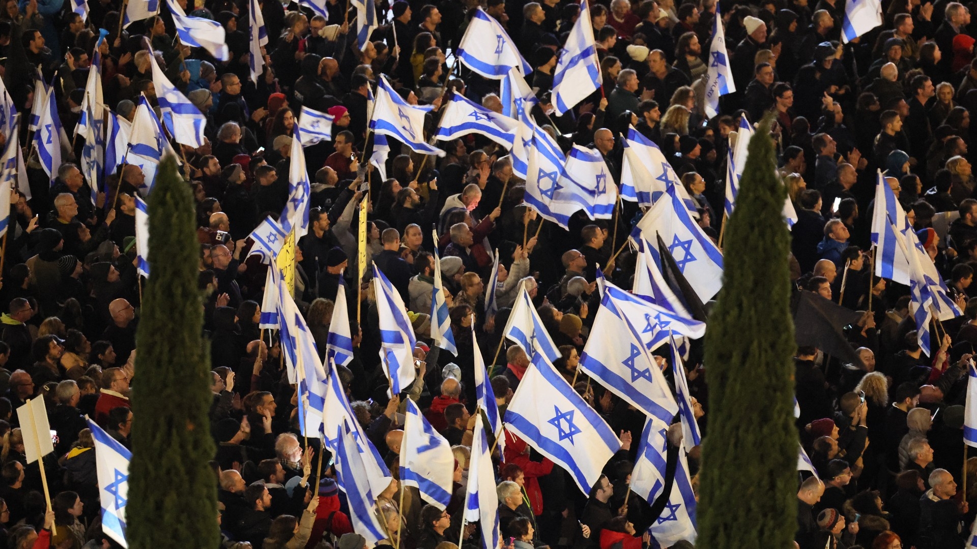 Israeli protesters attend a rally against Israel's new government in Tel Aviv on 14 January 2023 (AFP)