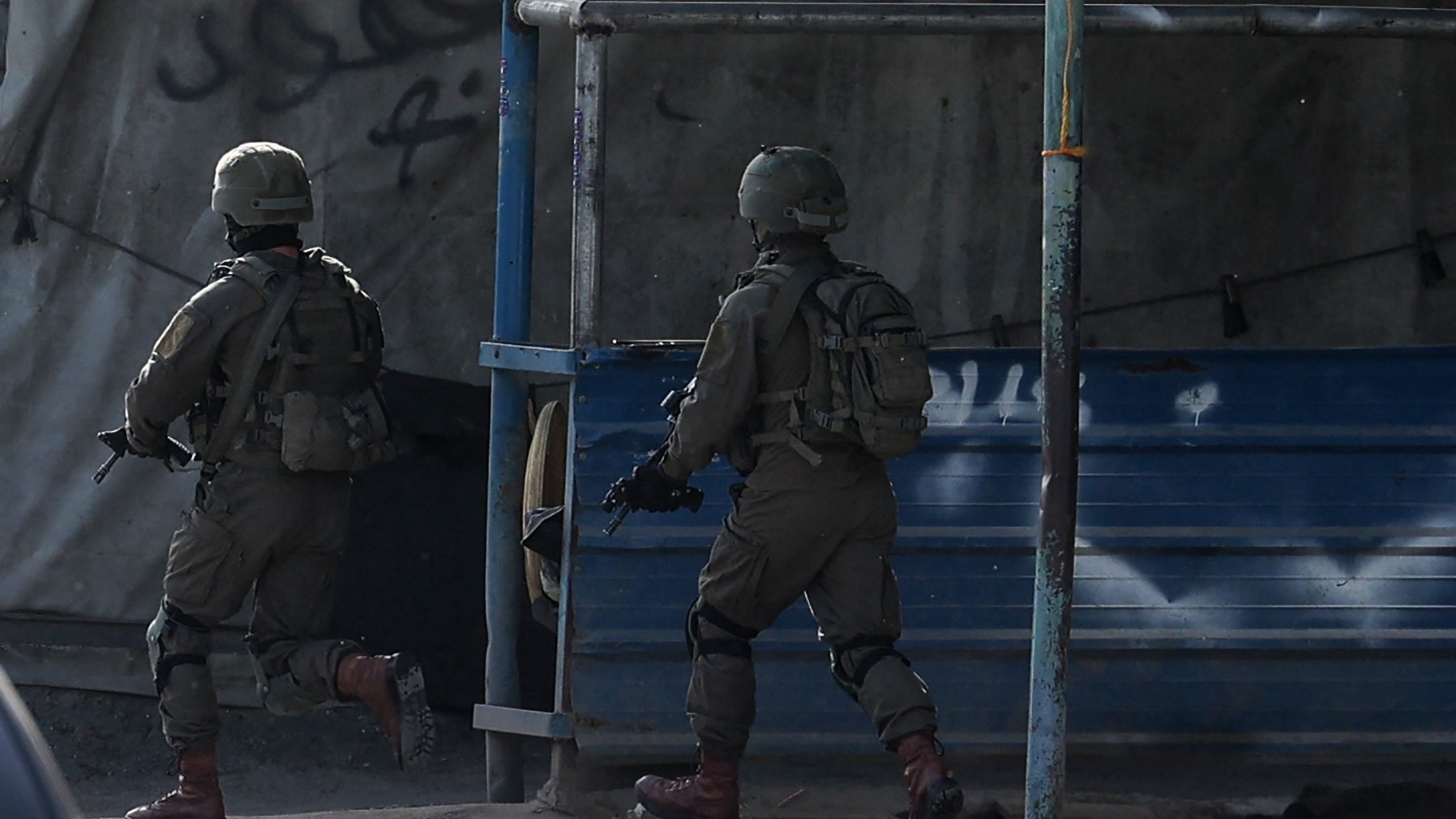 Israeli troops during a raid looking for suspects related to a gunman from Jenin on 10 April 2022.
