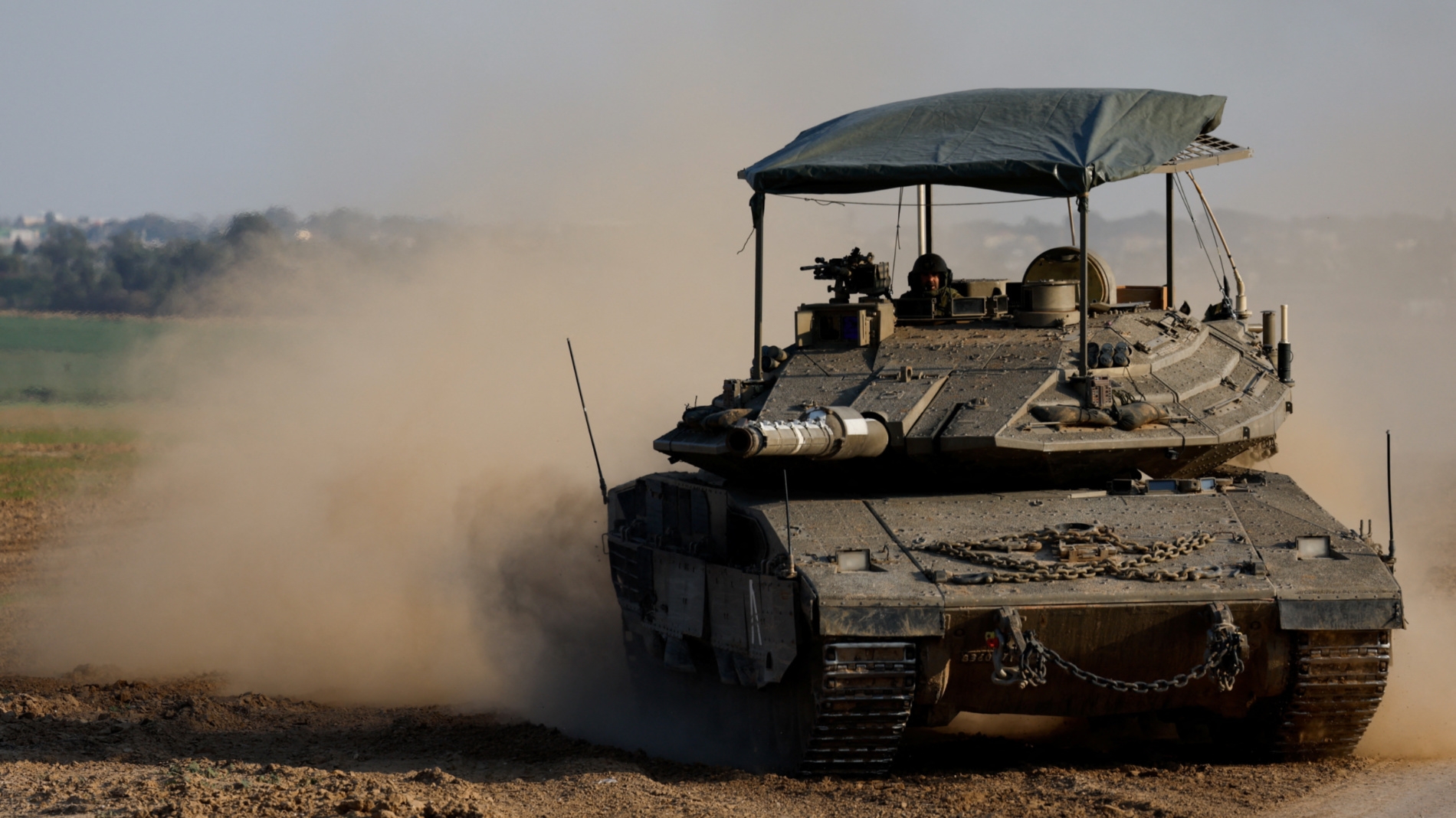An Israeli tank manoeuvres near the Israel-Gaza border on 16 January, 2024 (Reuters/Amir Cohen)