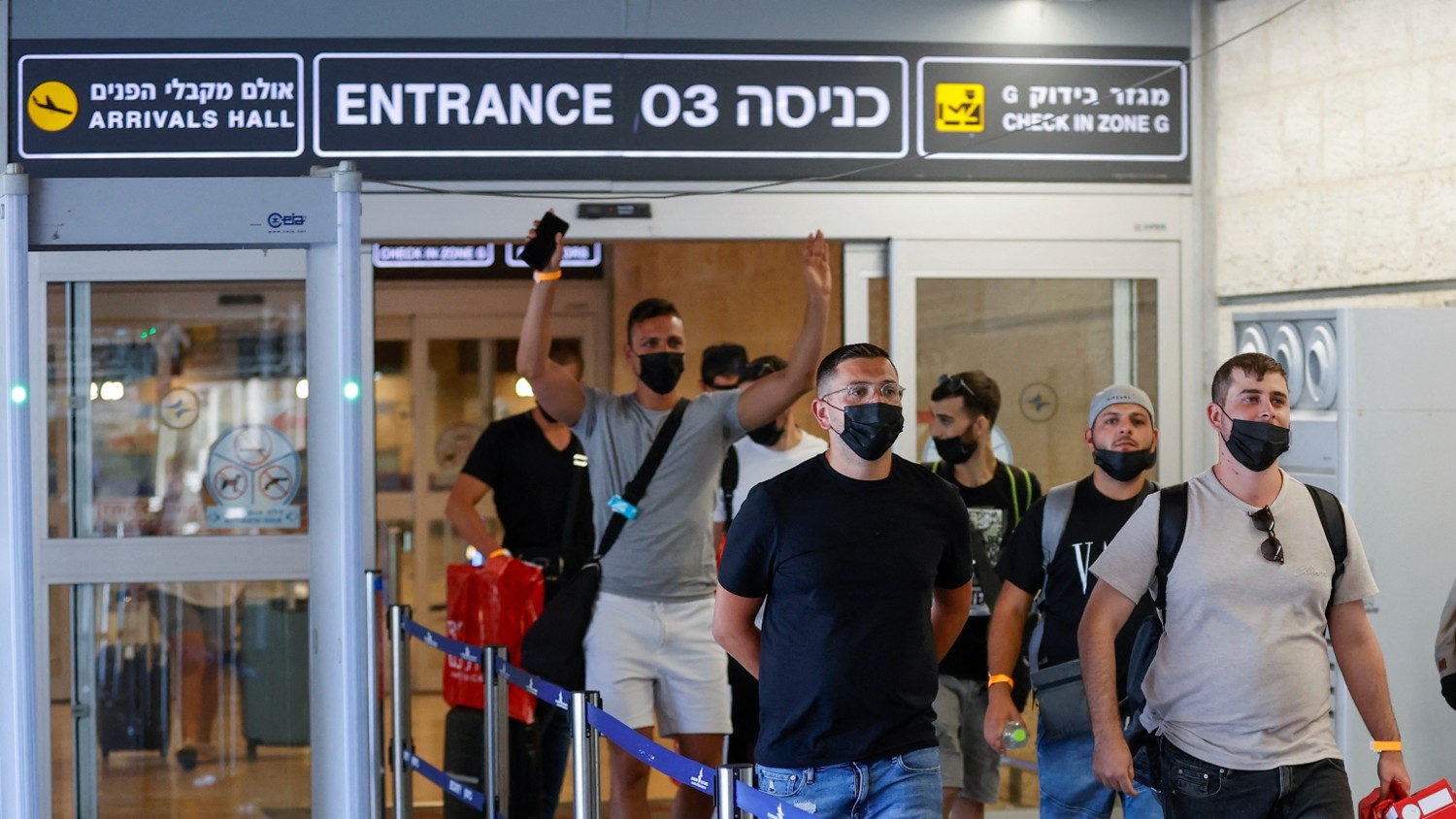 Tourists arrive to Israel's Ben Gurion Airport on 23 May 2021, after a partial re-opening of the border to inoculated tourists from 14 countries.