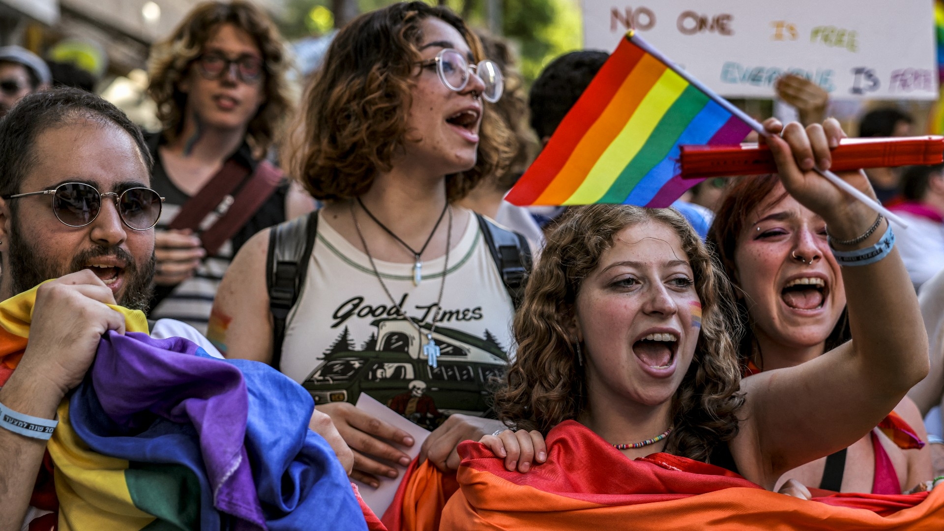 Participants chant slogans as they march during the annual Jerusalem Pride Parade in the city centre on 2 June 2022 (AFP)