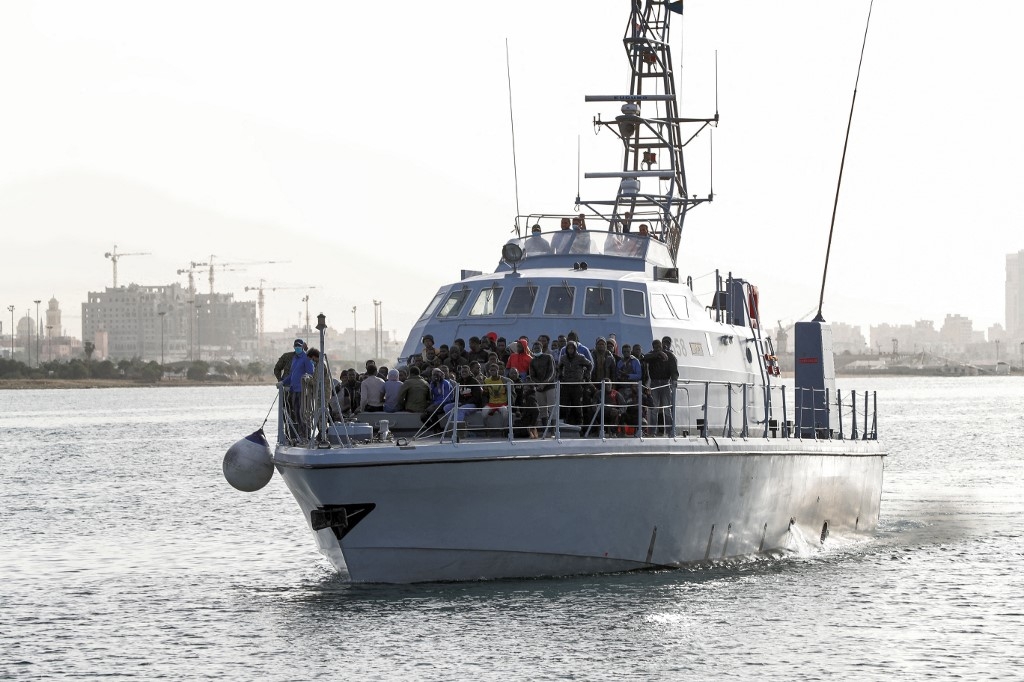 Migrants arrive in Tripoli on 29 April 2021 after the coastguard intercepted an boat carrying 99 migrants off its west coast.